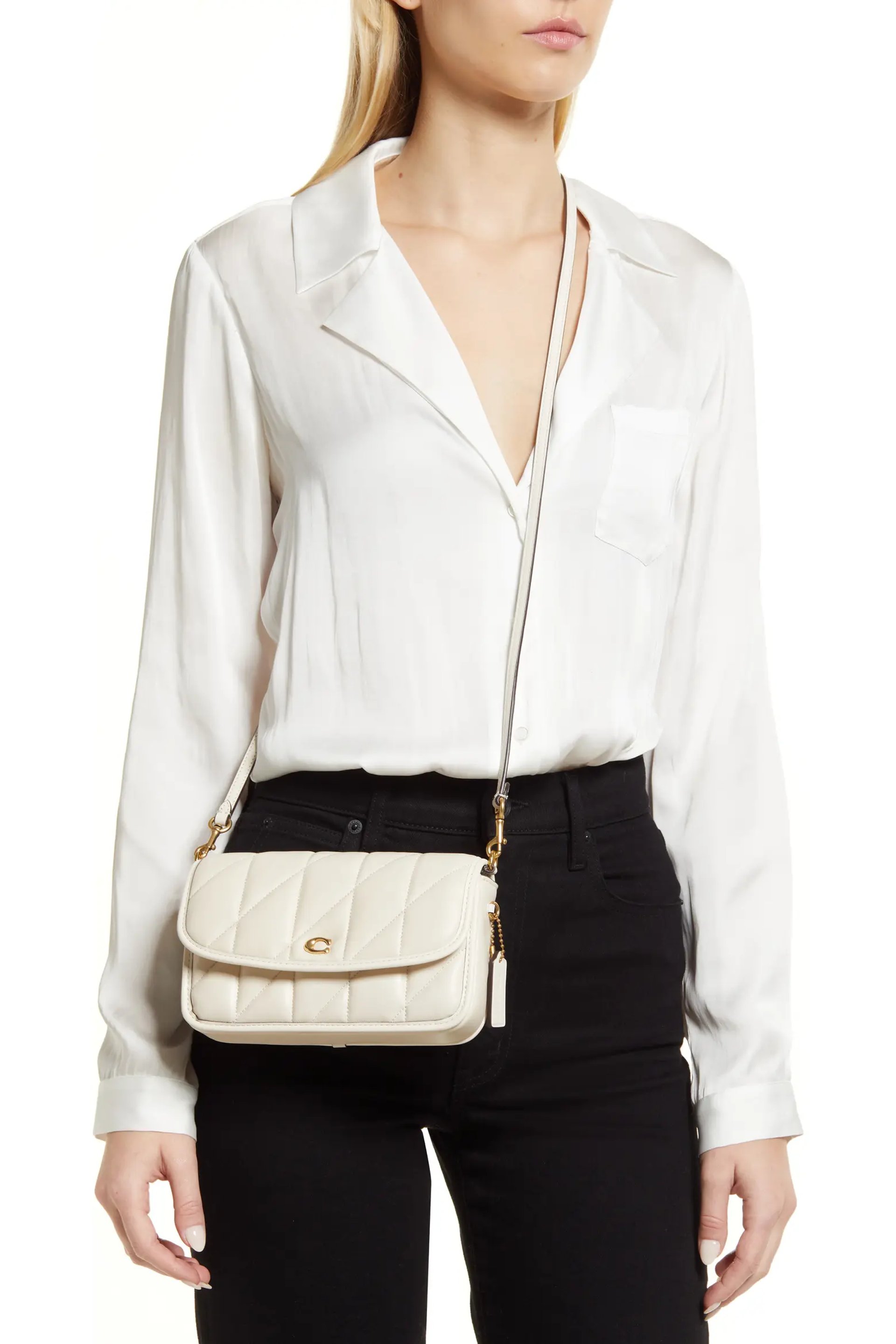 Ivory quilted crossbody bag styled with a blush corset top and denim mini skirt