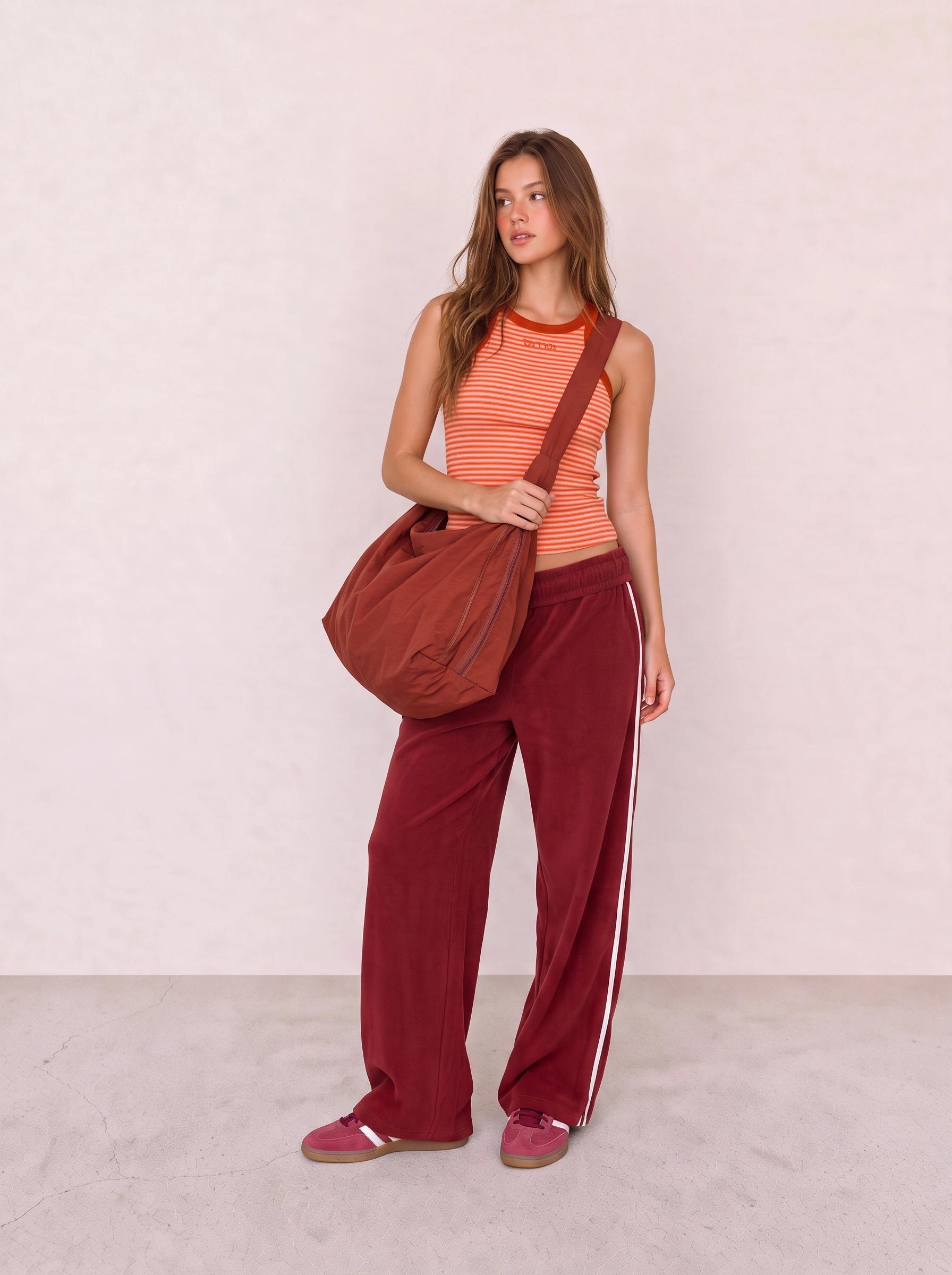 Orange Striped Tank and Burgundy Track Pants Outfit