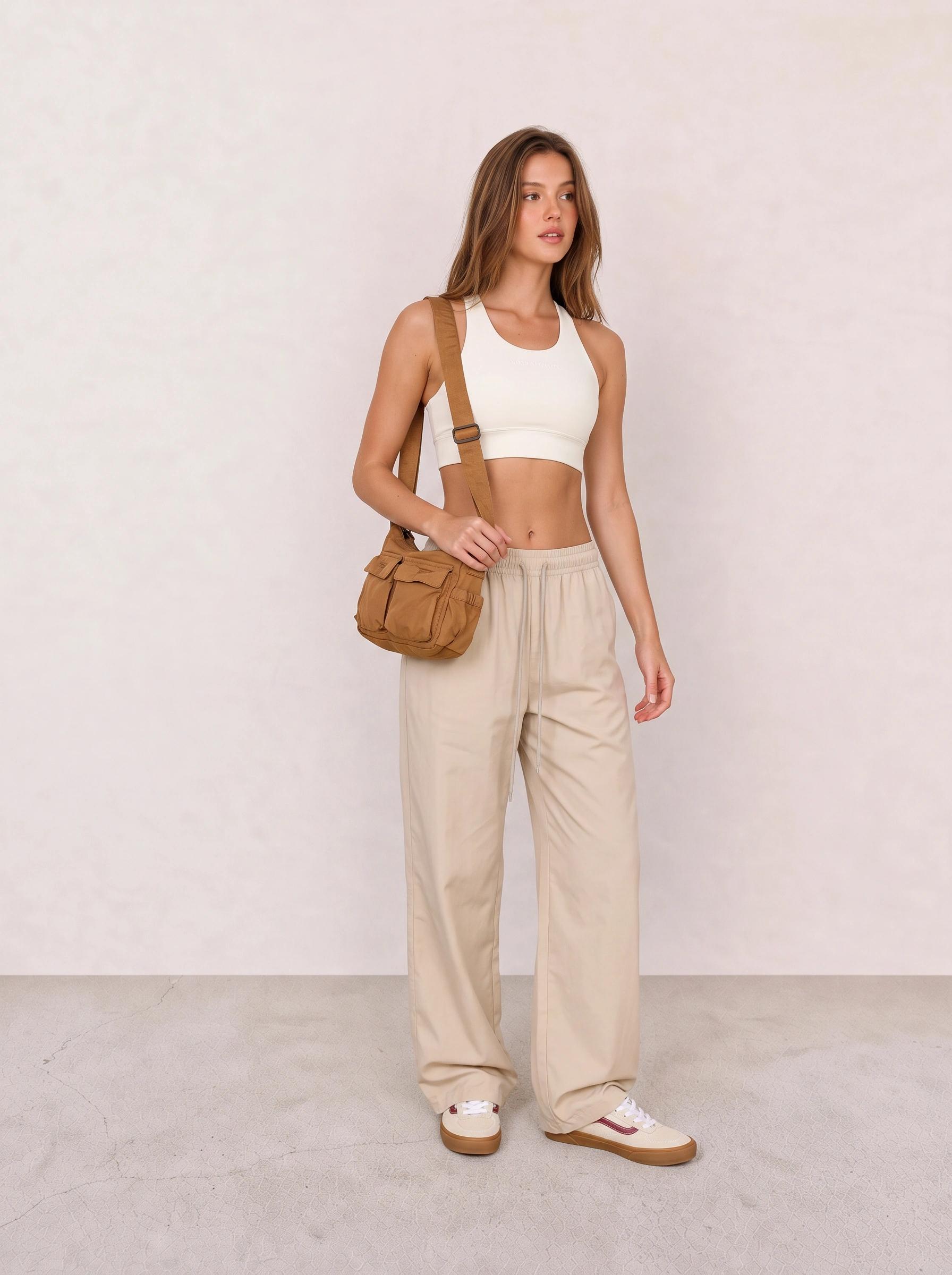 White Sports Bra and Beige Track Pants Outfit