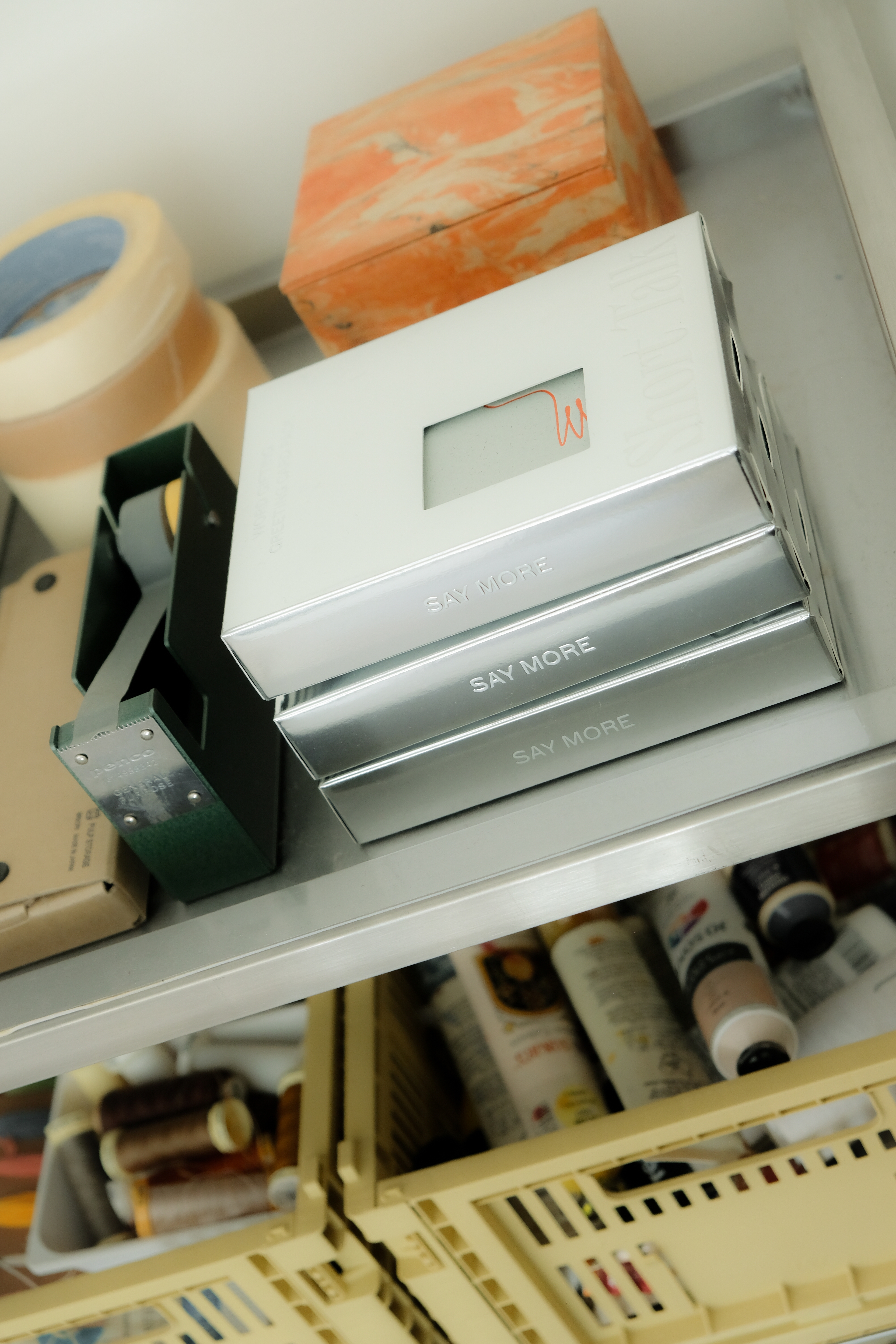 A workstation with a stack of Short Talk packs