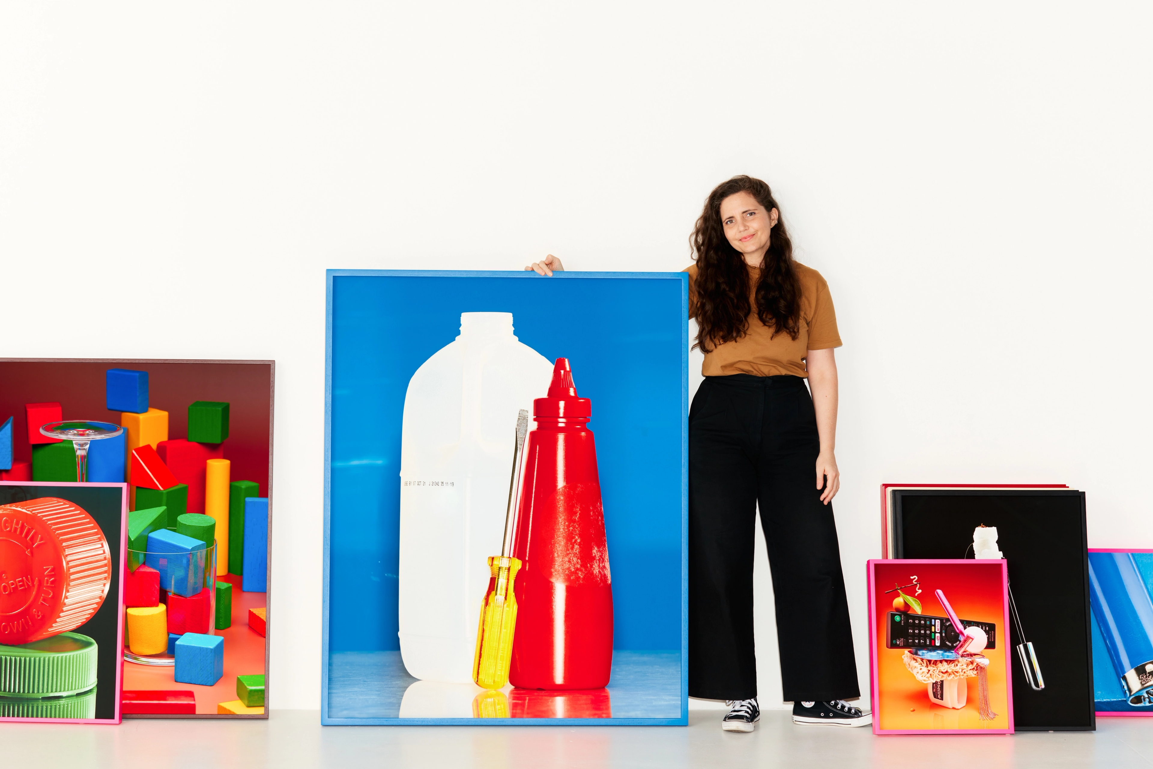 Shelley on set with large pieces of artwork