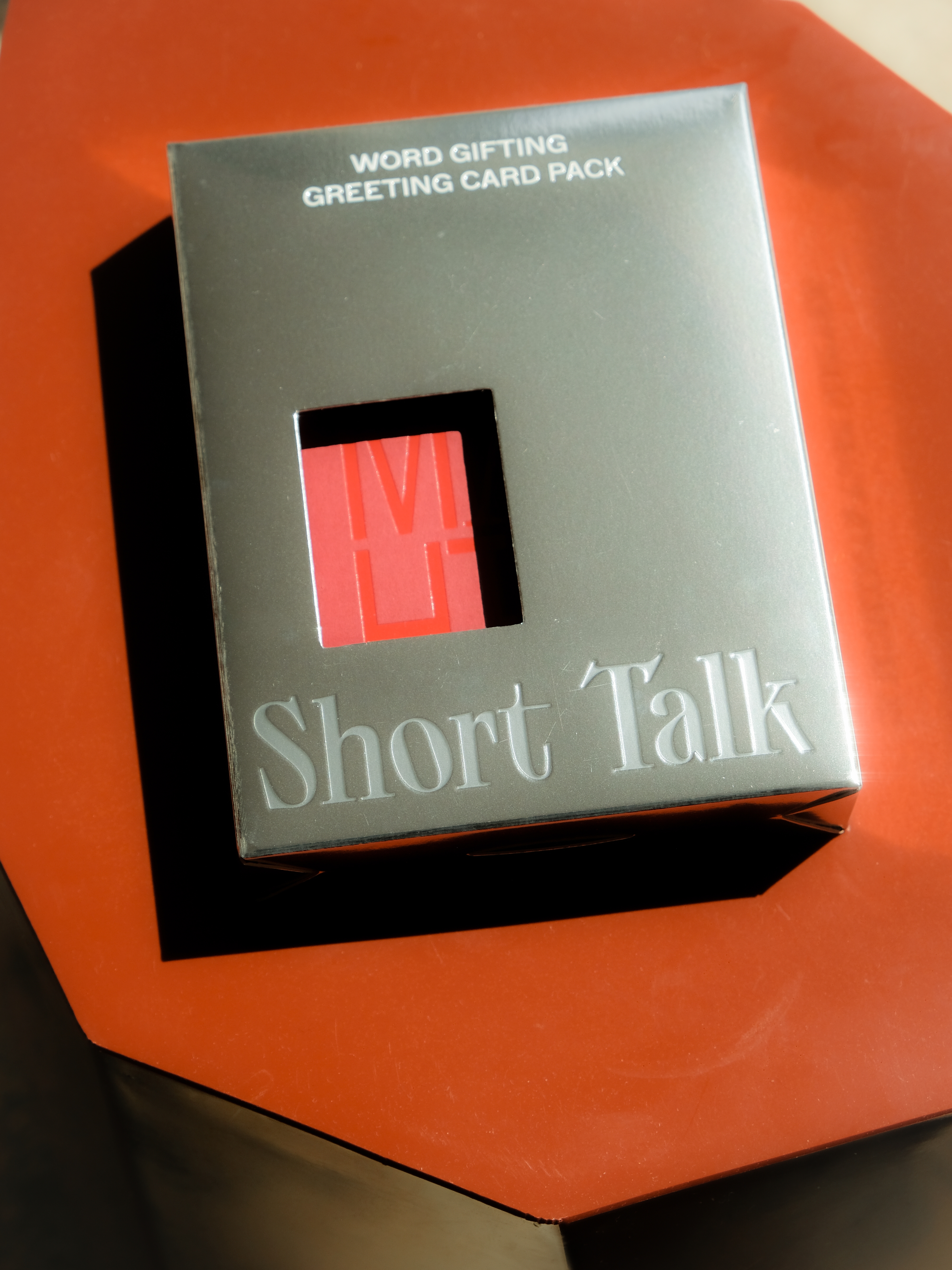 A workstation with a stack of Short Talk packs
