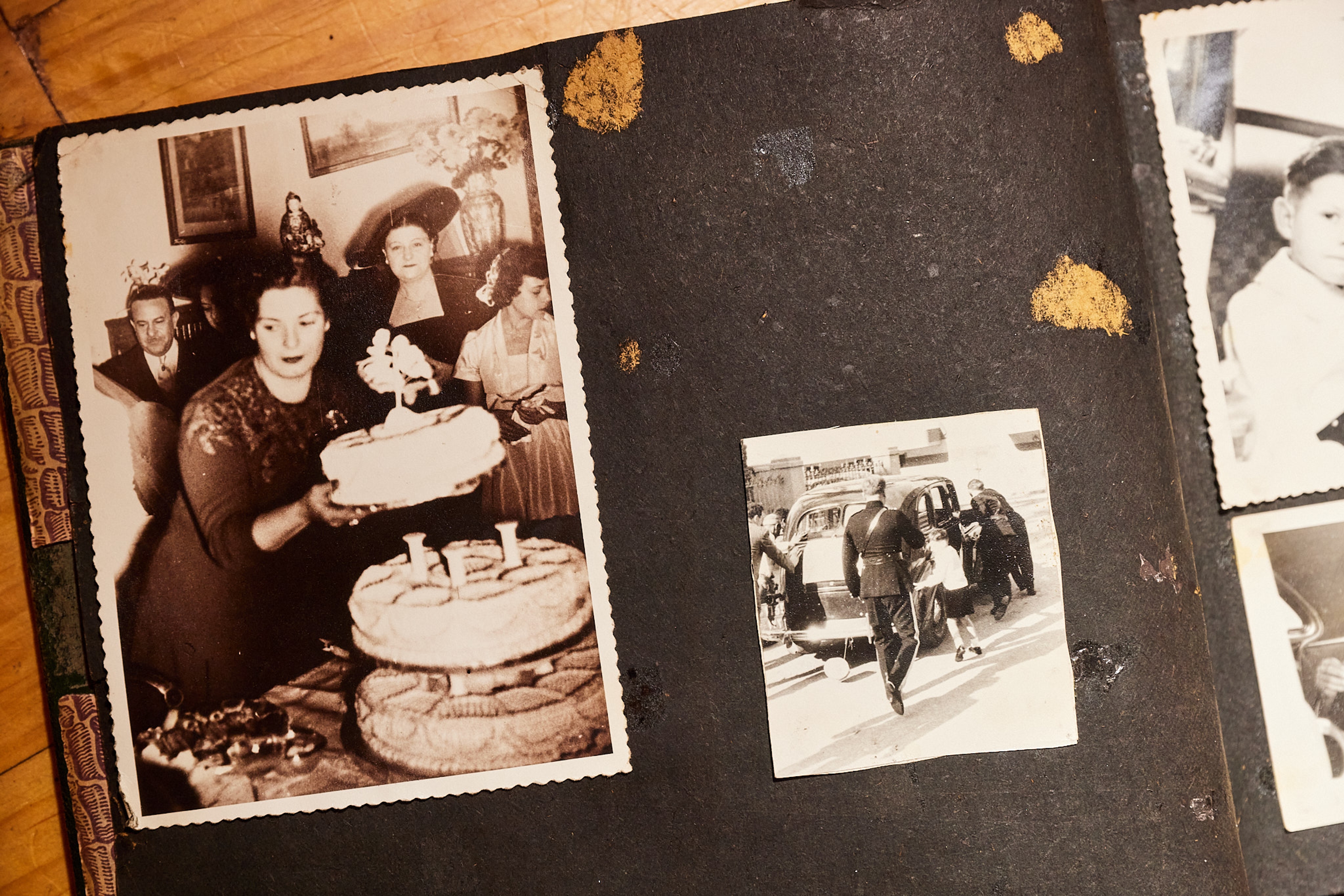An old photo album with photo of cake