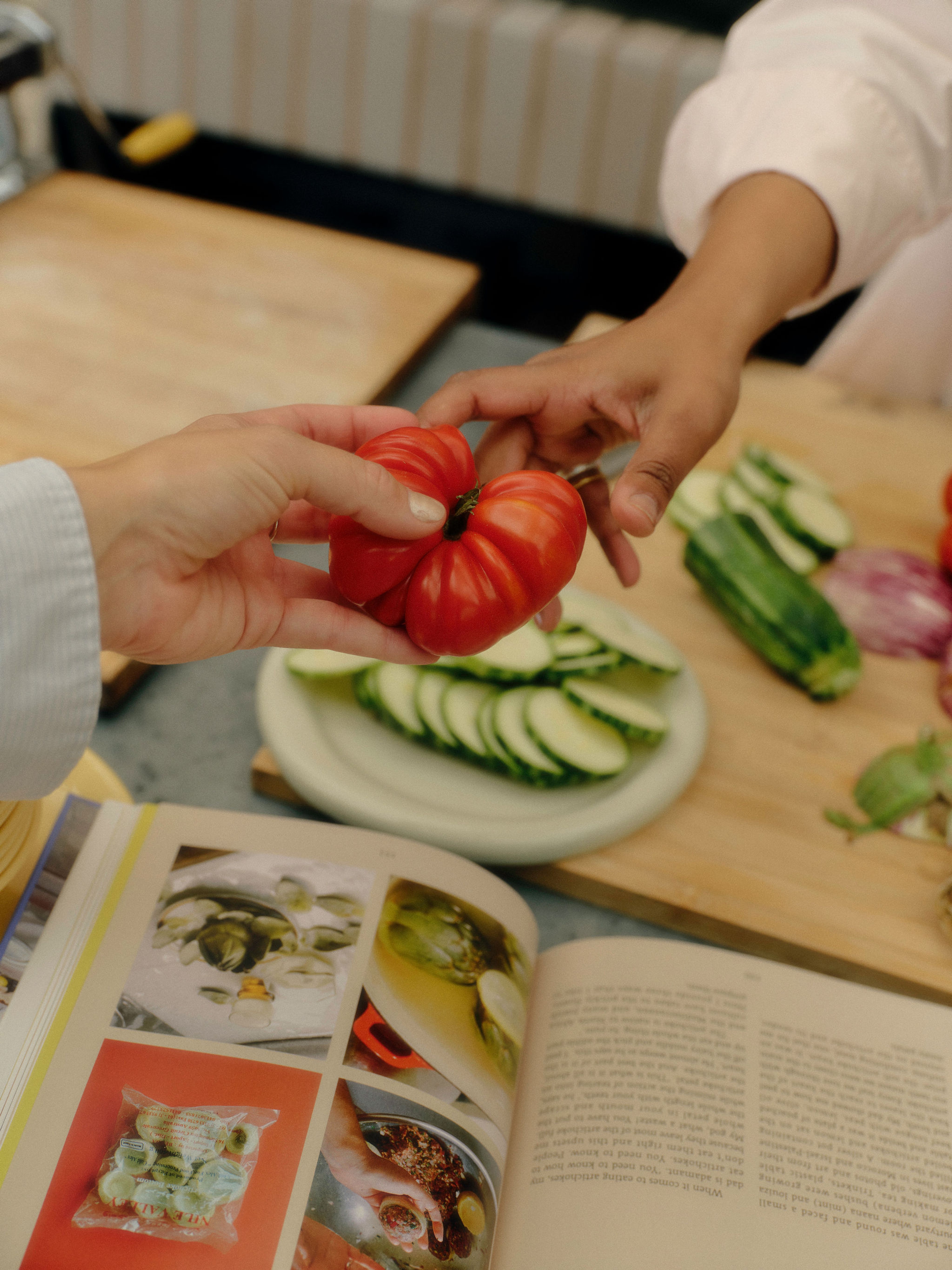 Two shelves of a bookcase filled with various books