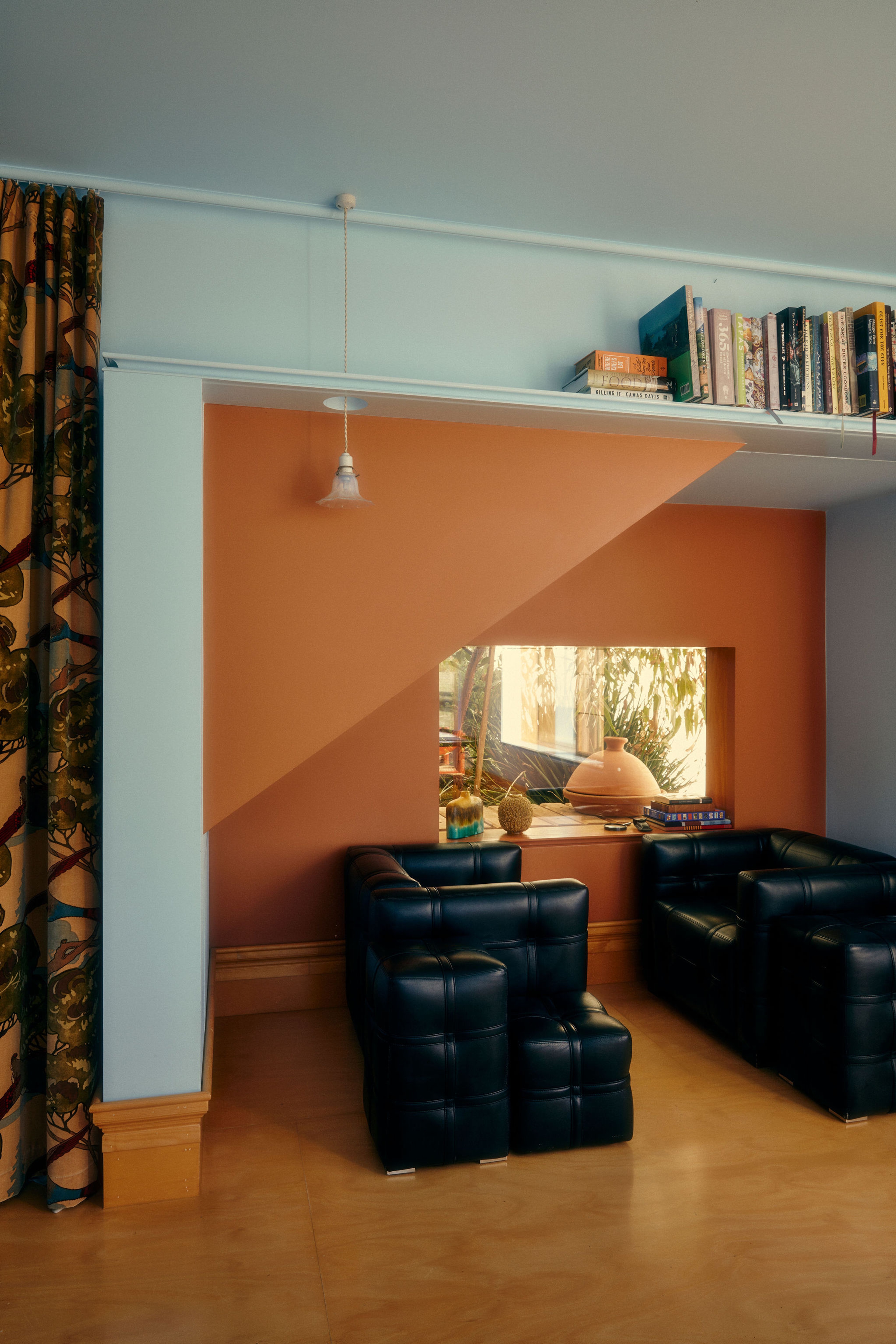 A beautiful white dresser below a window