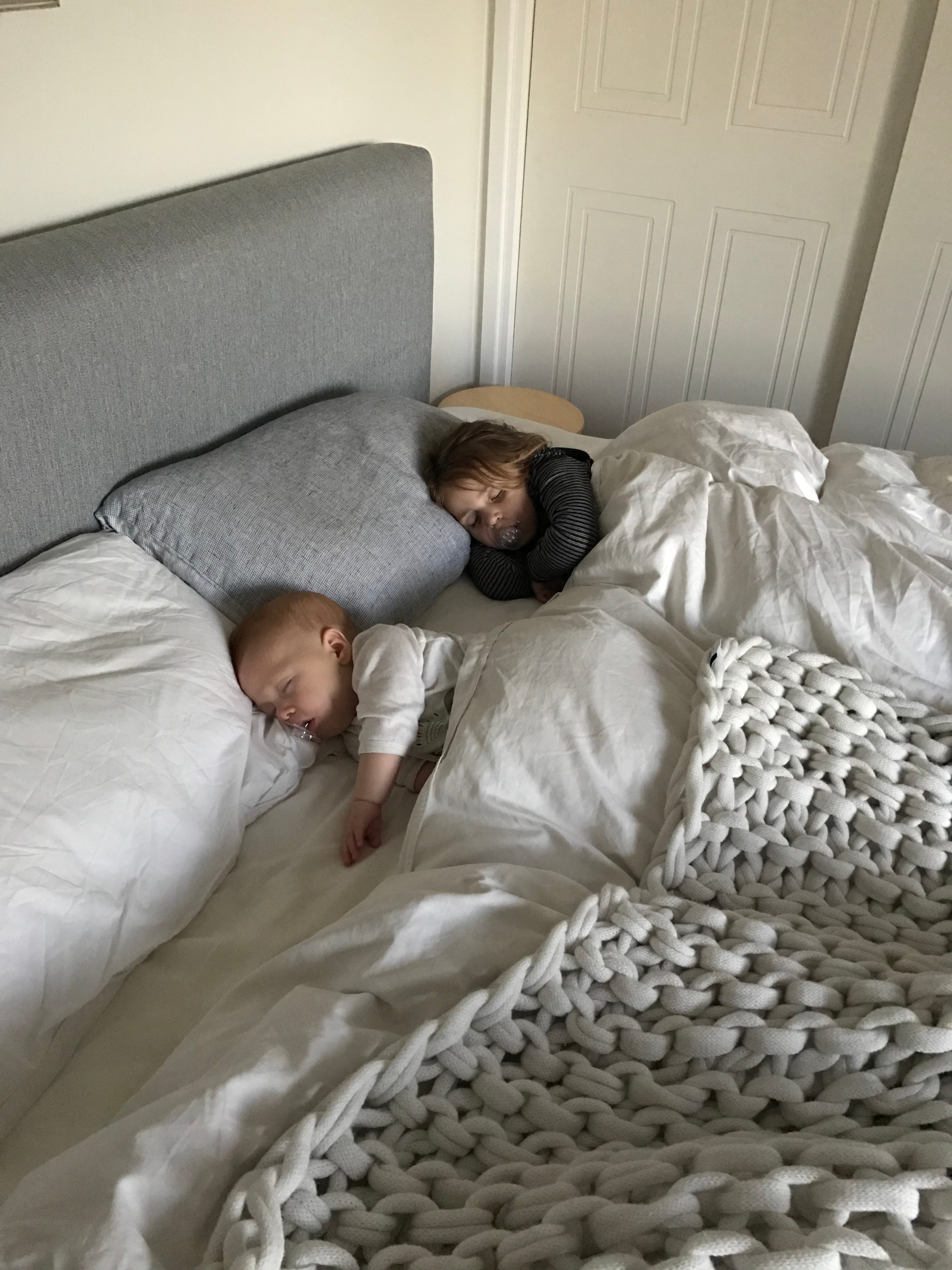 Babies asleep in bed