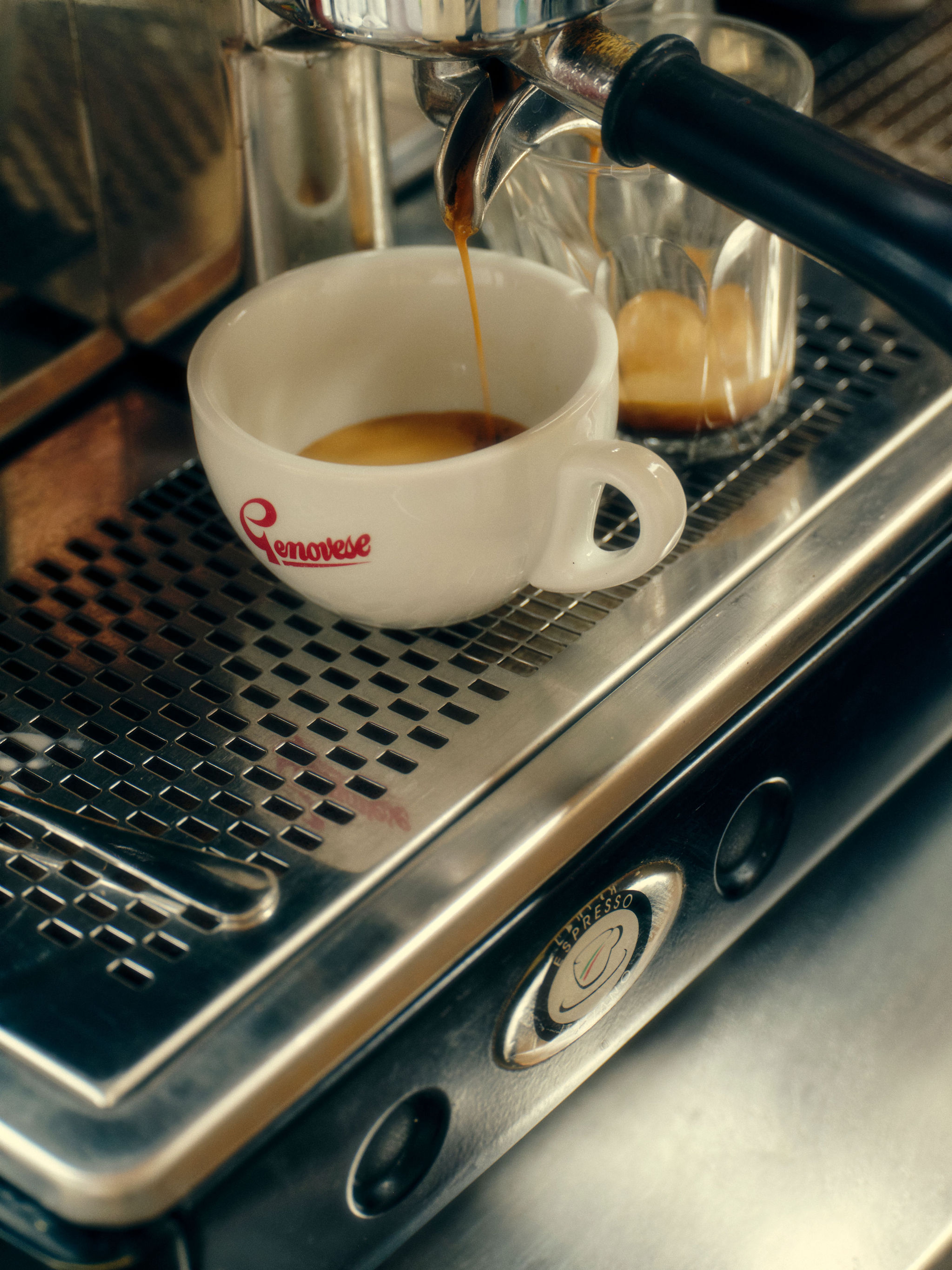 A bookshelf against a wall with washed out paint