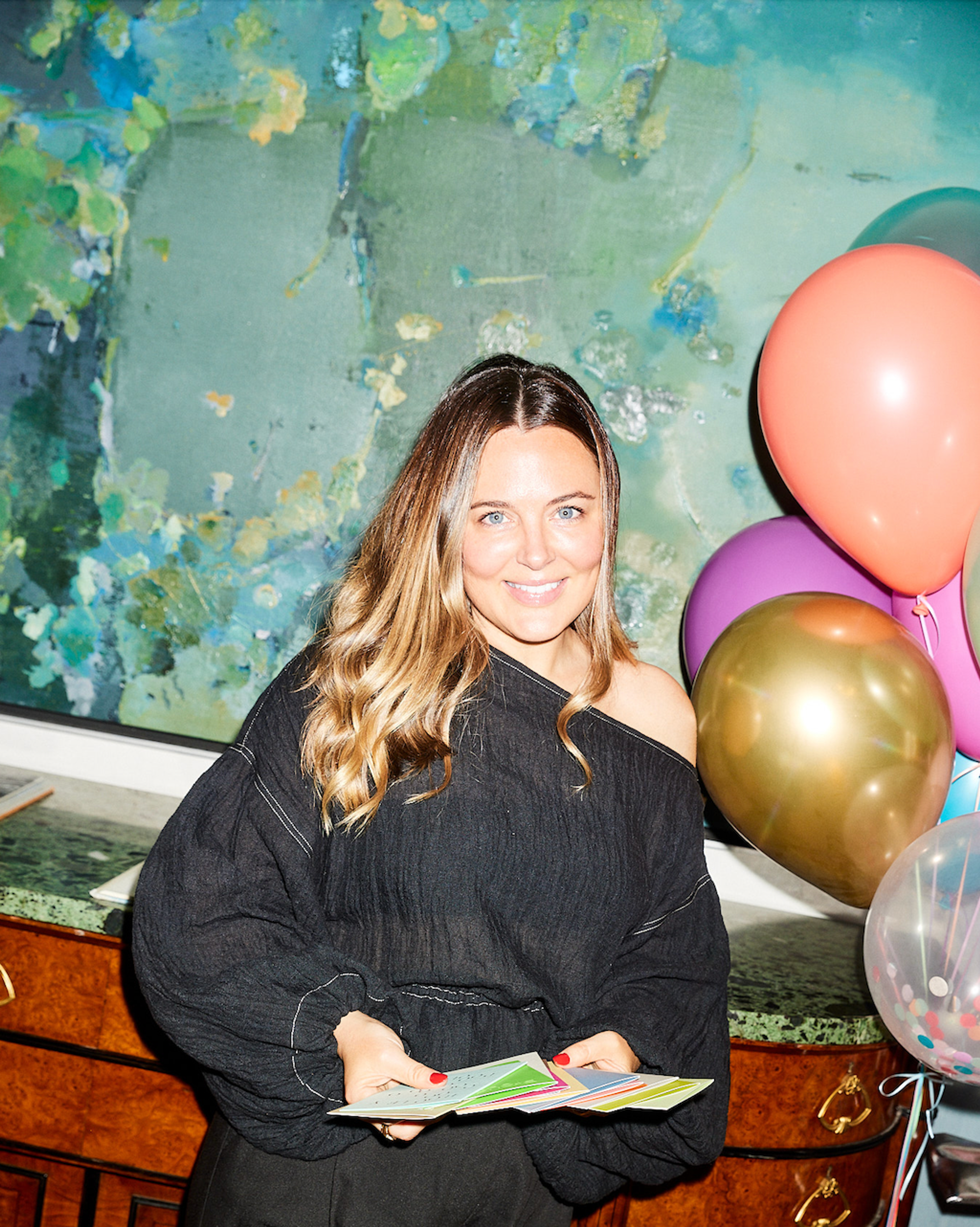 Jess on set with cards