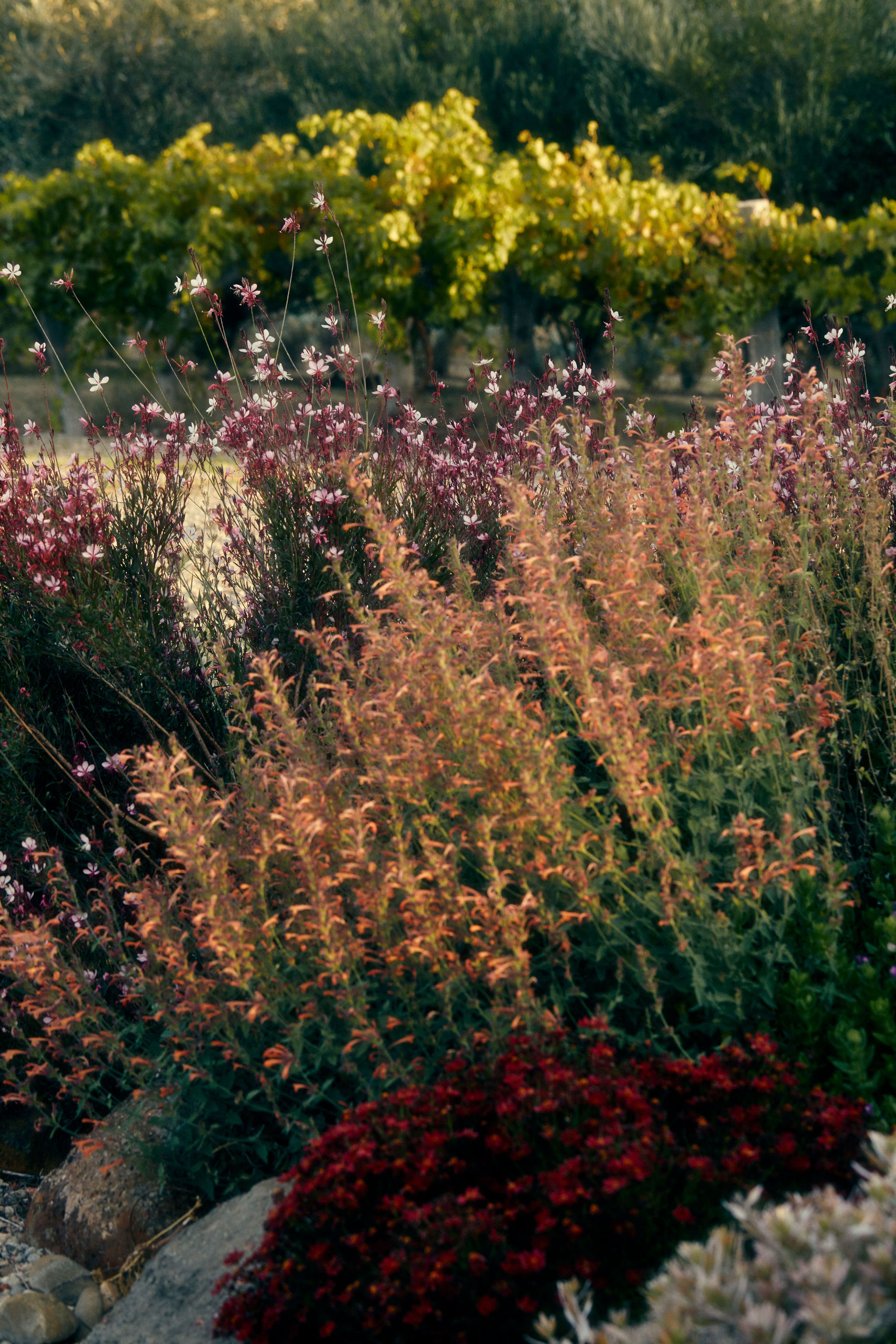 An antique wardrobe with a straw basket ontop