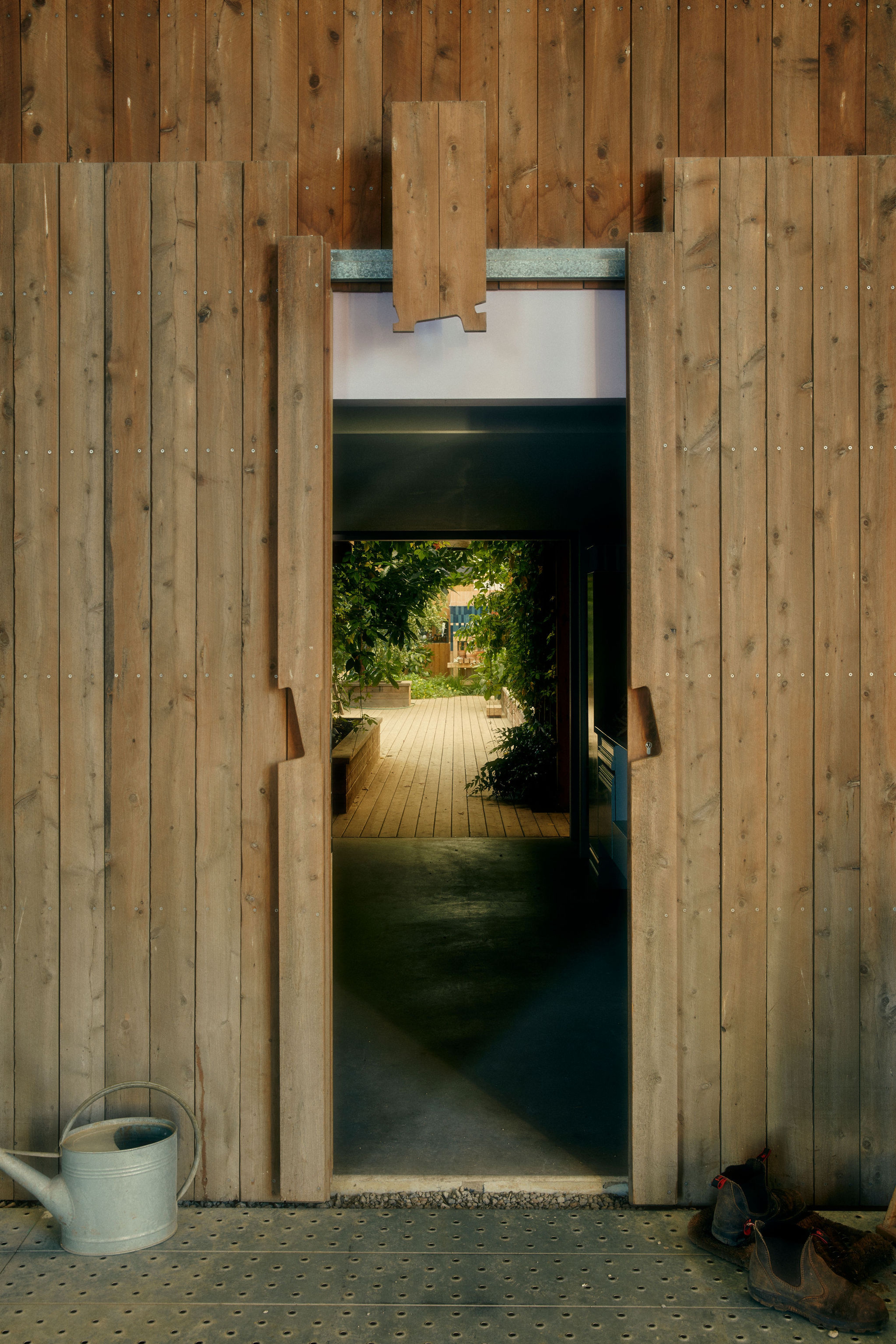 A door ajar with a brass handle