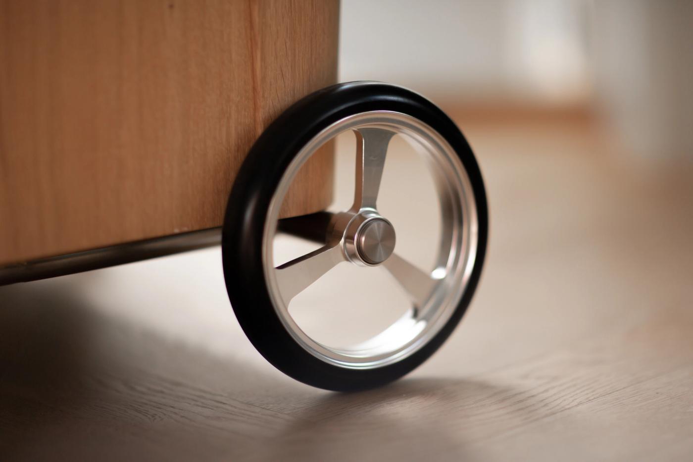 ÆRLIG molded oak trolley for indoor and outdoor use designed by Anker Bak