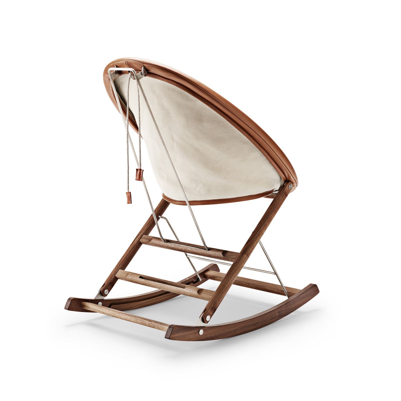 Rocking Nest Chair by Carl Hansen & Søn — a foldable rocking chair in walnut wood with a suspended canvas seat and steel cable details, shown in profile on a white background.