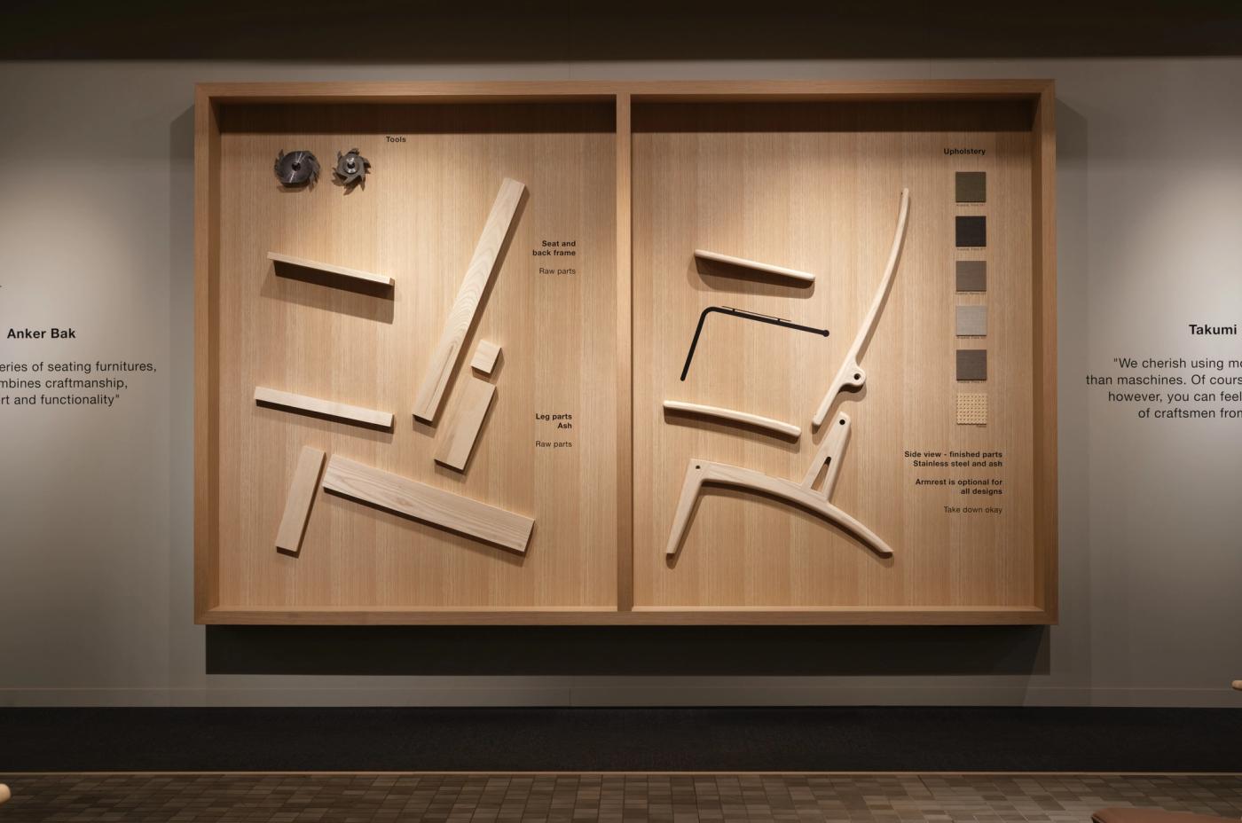 Wall display with two oak panels showing wooden frame parts, steel fittings and curved oak components laid out as a set of GAZE chair parts, with colour swatches on the right panel.