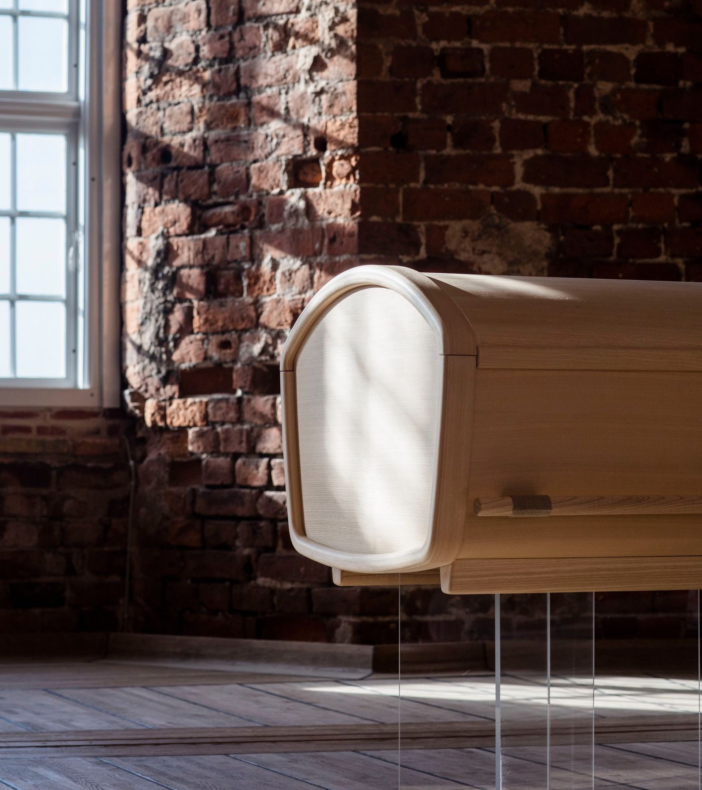 Gently rounded organic coffin by Anker Bak for Fredahl Rydéns