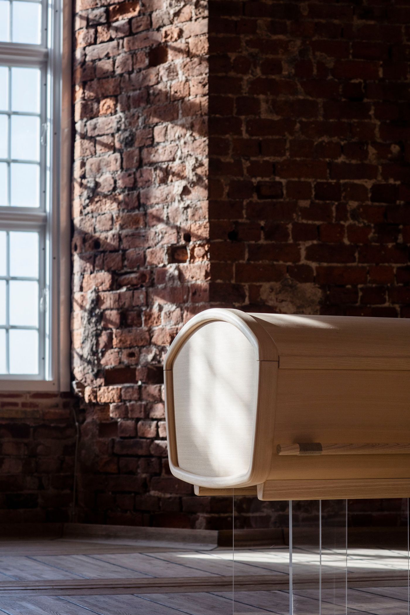 Gently rounded organic coffin by Anker Bak for Fredahl Rydéns
