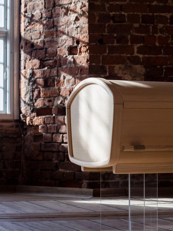 Gently rounded organic coffin by Anker Bak for Fredahl Rydéns