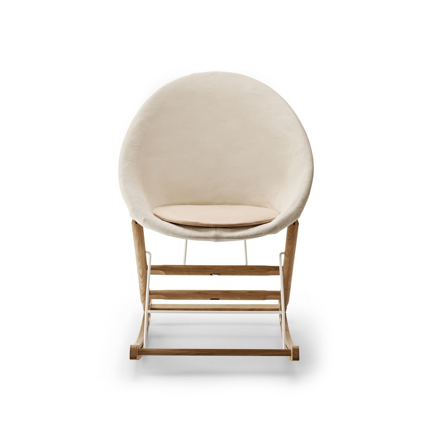 Rocking Nest Chair by Carl Hansen & Søn — a foldable rocking chair in walnut wood with a suspended canvas seat and steel cable details, shown in profile on a white background.