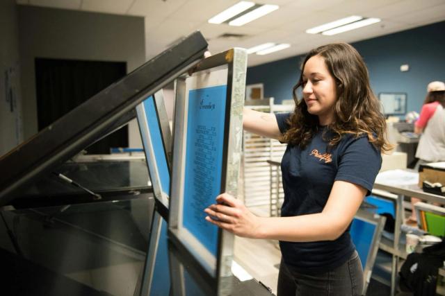 Woman preparing a screen for printing