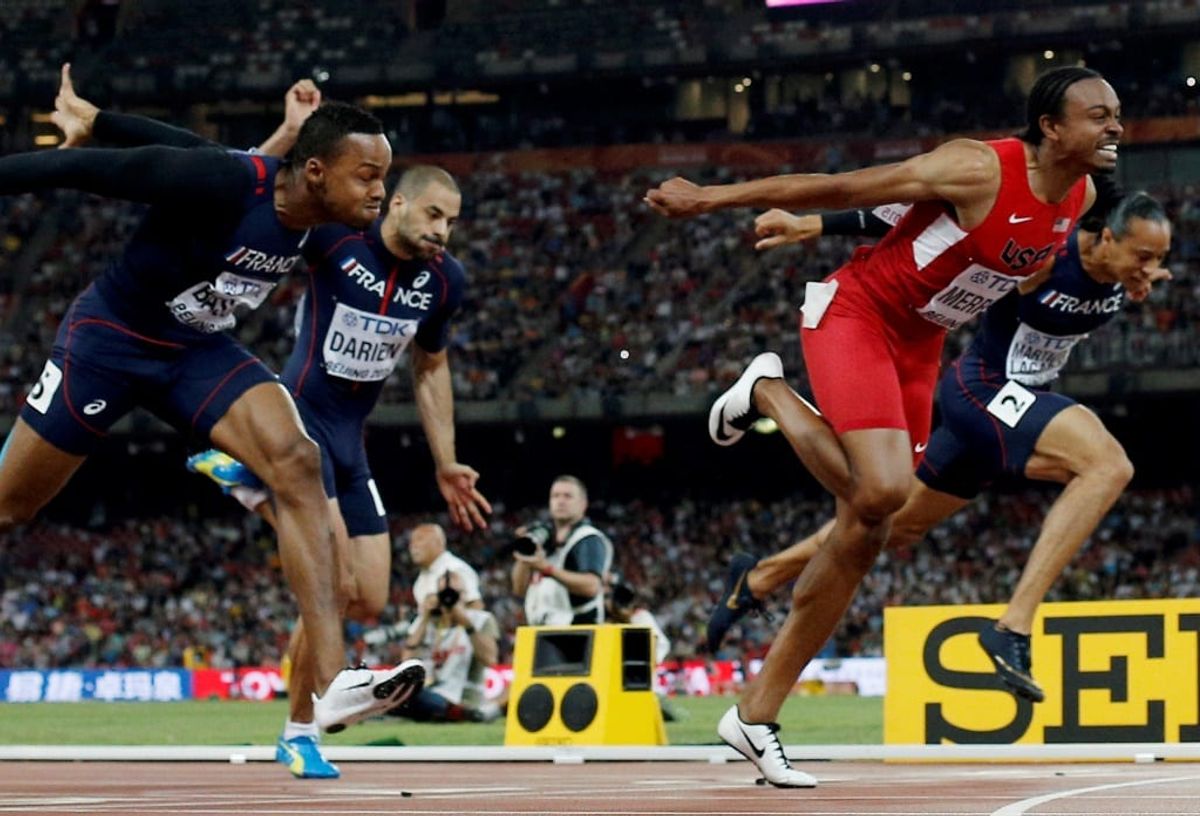 Gold medallist Russia's Sergey Shubenkov (2L) crosses the finish line to win ahead of (L-R) Jamaica's Omar McLeod, France's Dimitri Bascou, France's Garfield Darien, bronze medallist USA's Aries Merritt and France's Pascal Martinot-Lagarde in the men's 110 metres hurdles athletics event at the 2015 IAAF World Championships at the "Bird's Nest" National Stadium in Beijing on August 28, 2015.   AFP PHOTO / ADRIAN DENNIS