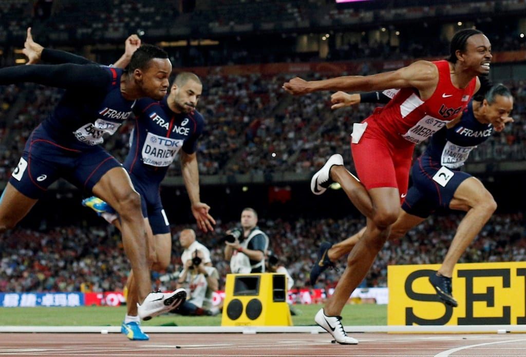 Gold medallist Russia's Sergey Shubenkov (2L) crosses the finish line to win ahead of (L-R) Jamaica's Omar McLeod, France's Dimitri Bascou, France's Garfield Darien, bronze medallist USA's Aries Merritt and France's Pascal Martinot-Lagarde in the men's 110 metres hurdles athletics event at the 2015 IAAF World Championships at the "Bird's Nest" National Stadium in Beijing on August 28, 2015. AFP PHOTO / ADRIAN DENNIS