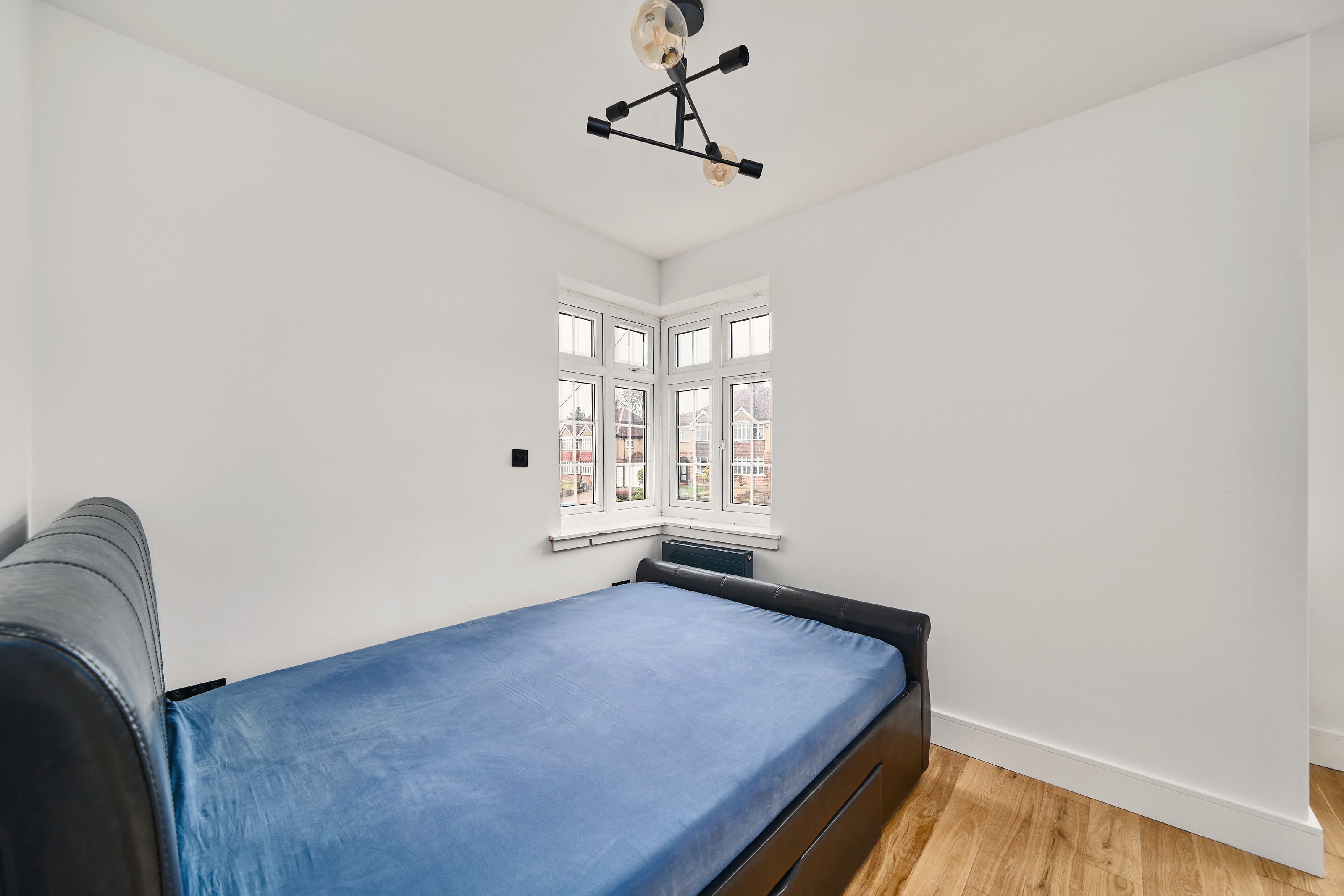 Bedroom with corner window after the work