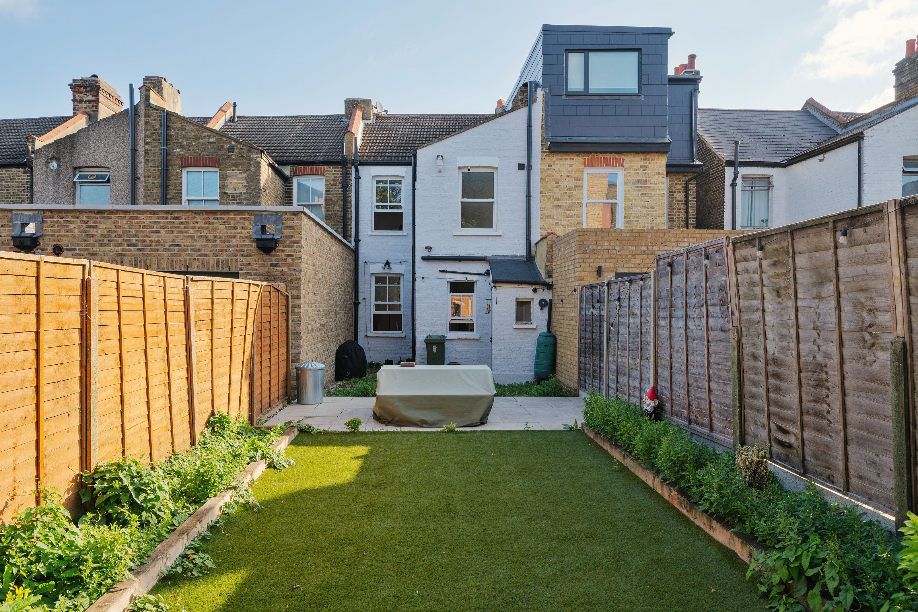 The garden before the work, looking back at the house with its original white-painted back addition