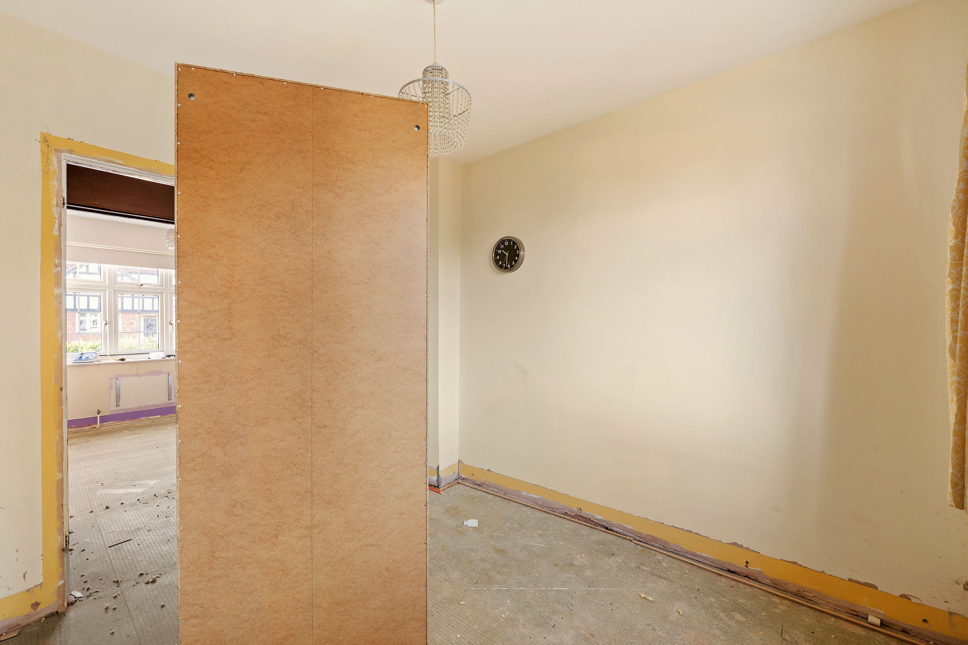 Second bedroom with built-in desk before the work