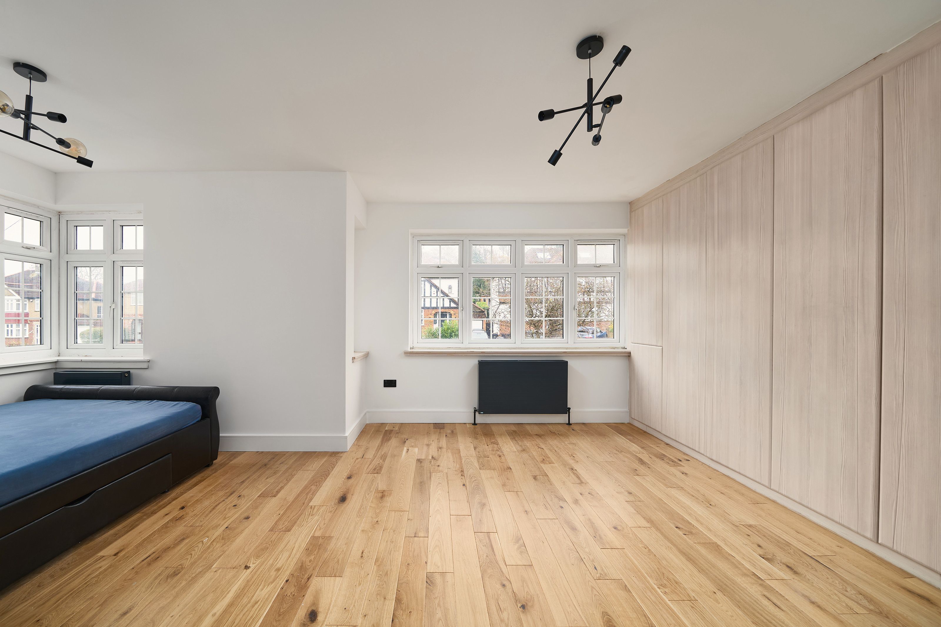 Bedroom with fitted wardrobes, from the door after the work