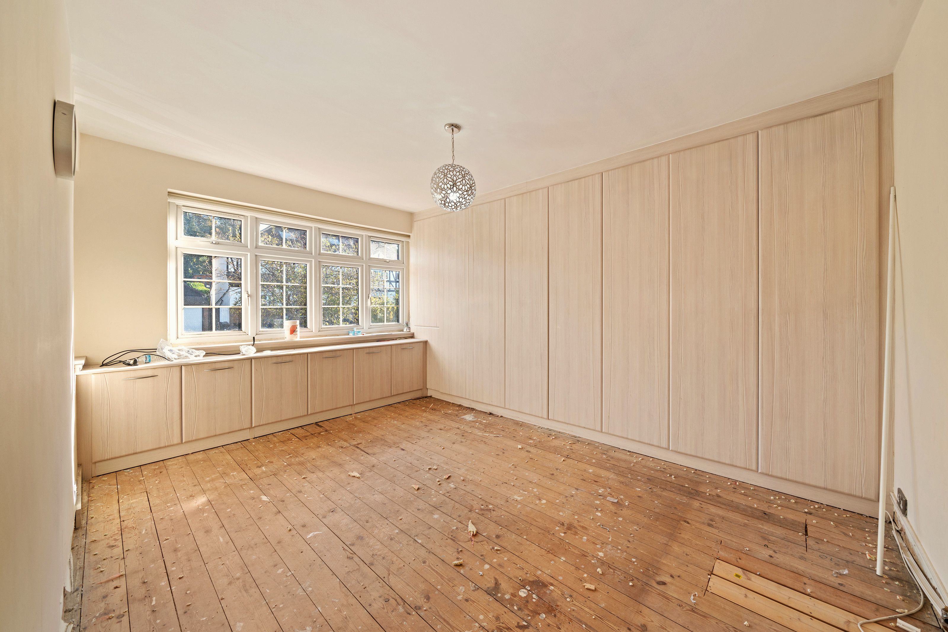 Bedroom with fitted wardrobes before the work