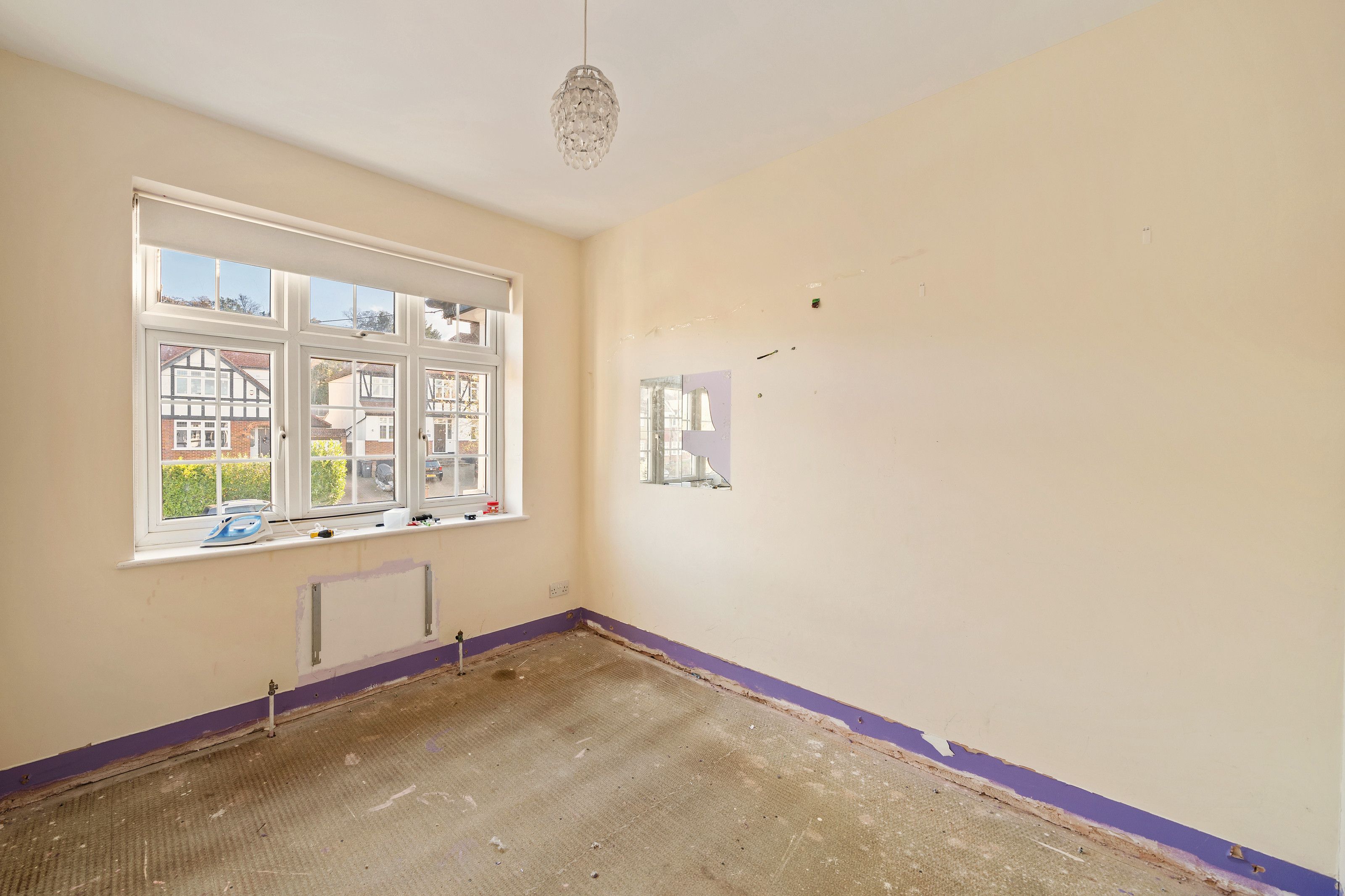Bedroom with built-in desk before the work