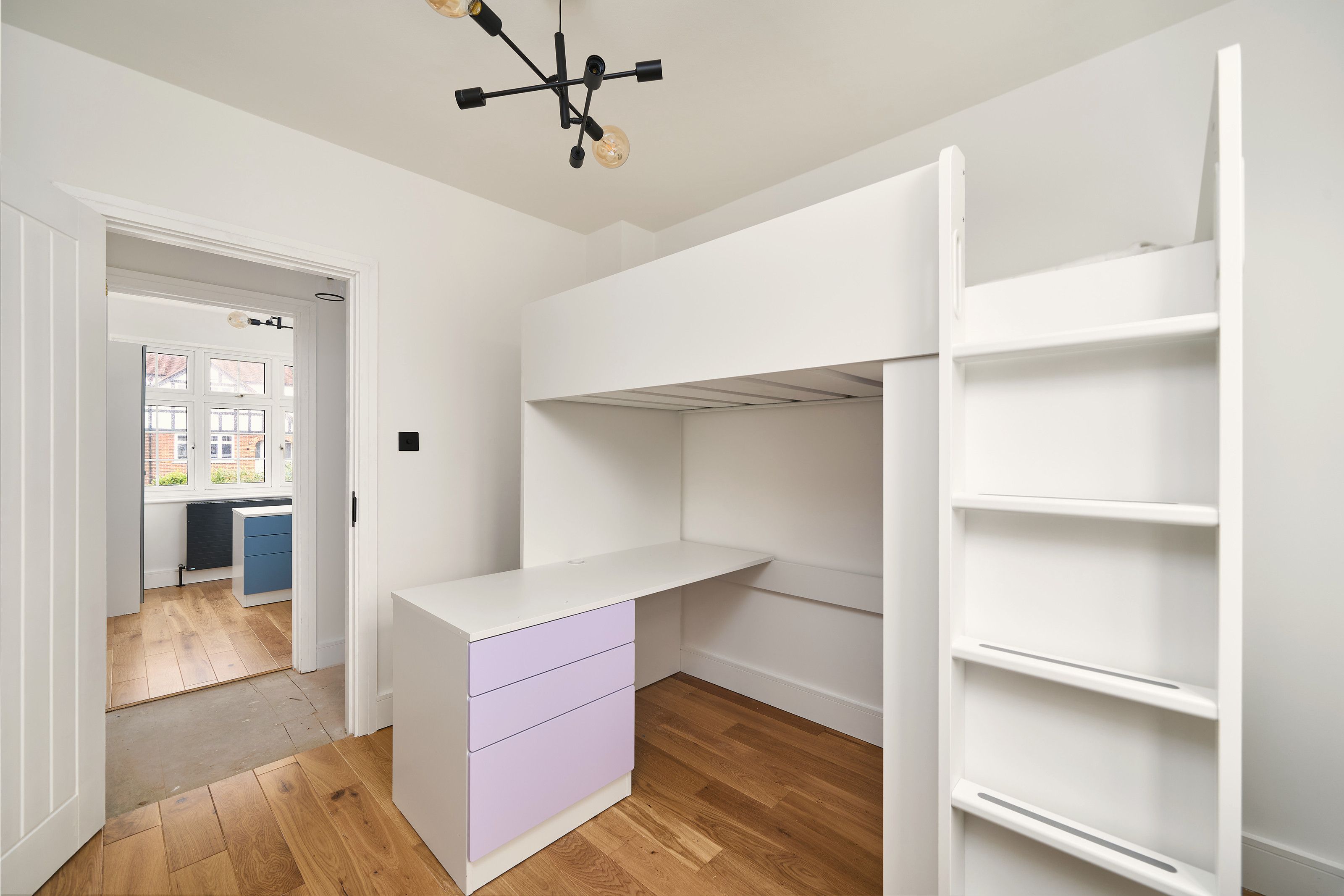 Second bedroom with built-in desk after the work