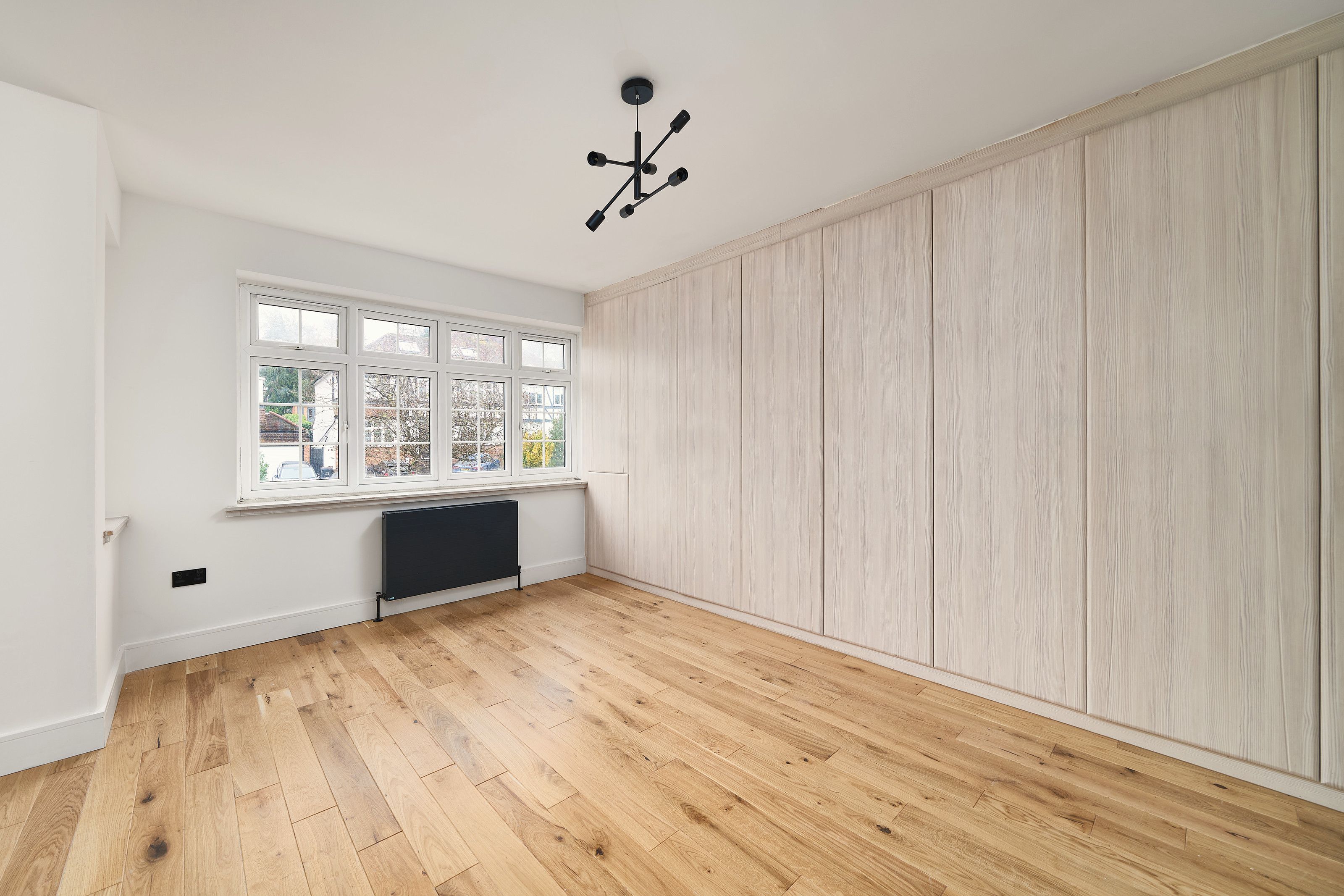 Bedroom with fitted wardrobes after the work