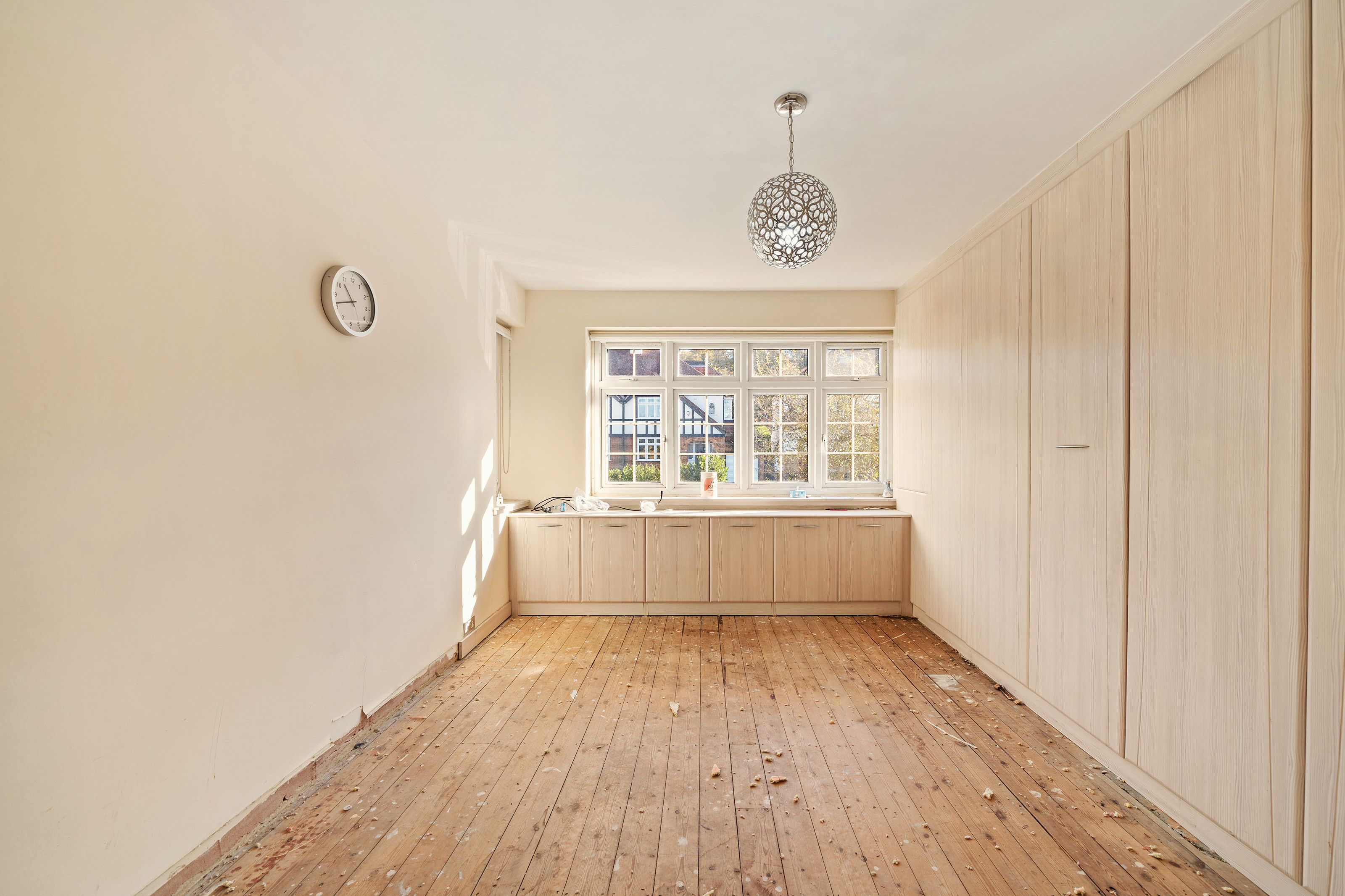 Bedroom with fitted wardrobes, from the door before the work