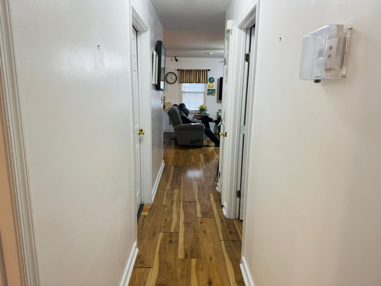 A comfortable, home-like living space where residents unwind and connect in a relaxed setting.