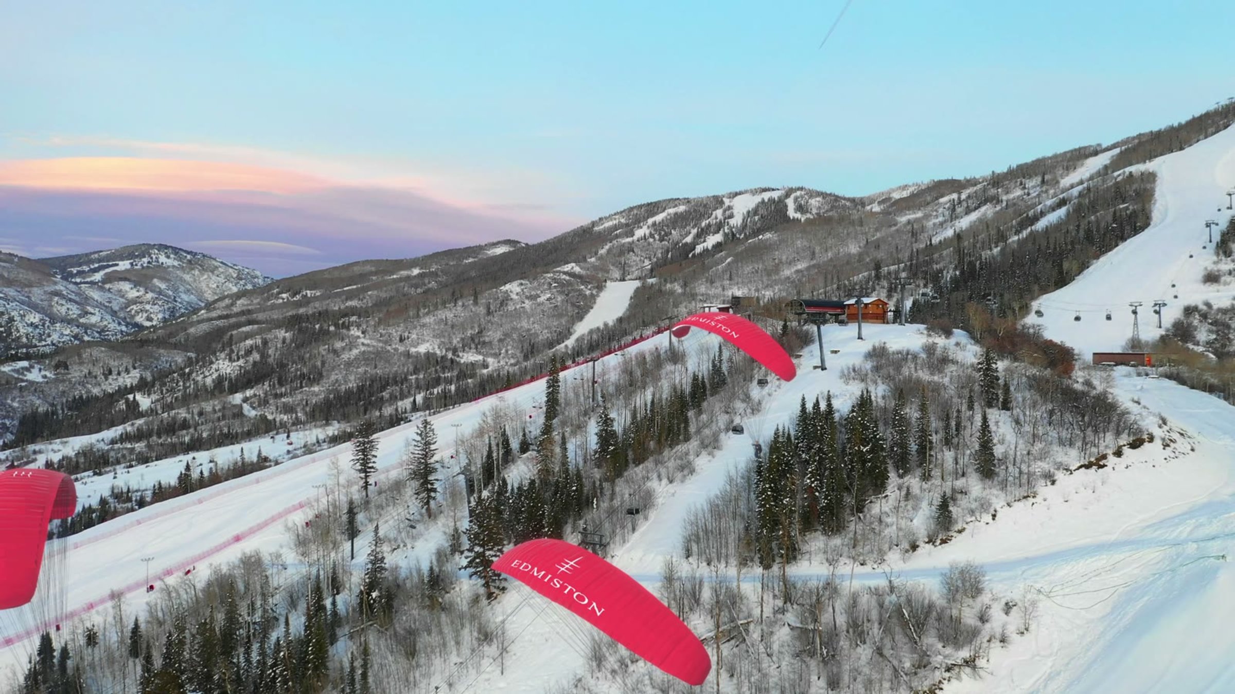 Second still from the Edmiston Aspen CGI film, paragliders descending towards the chairlift