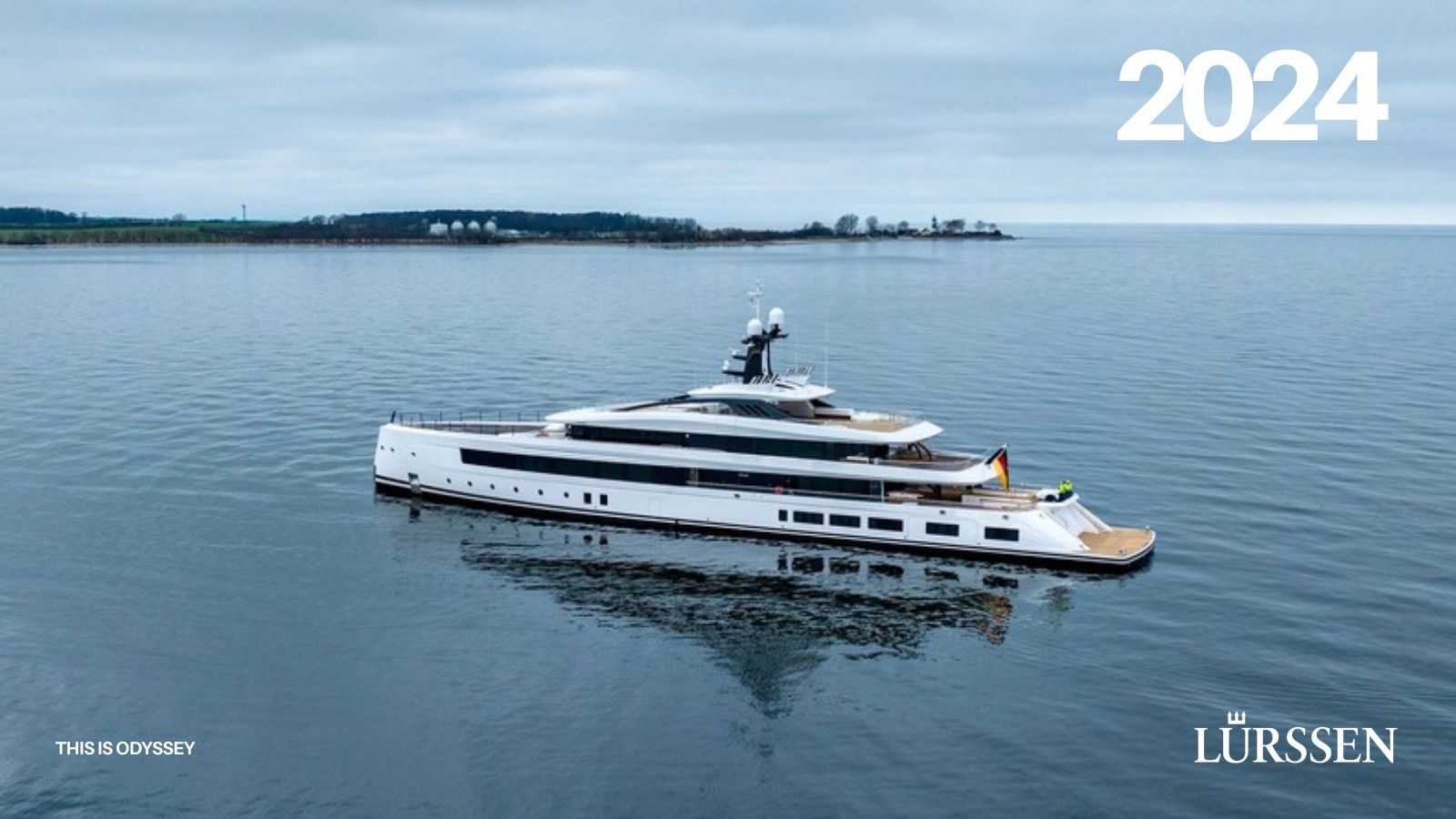 Cover of the 2024 Lürssen annual report by This is Odyssey, a yacht at anchor under a grey sky