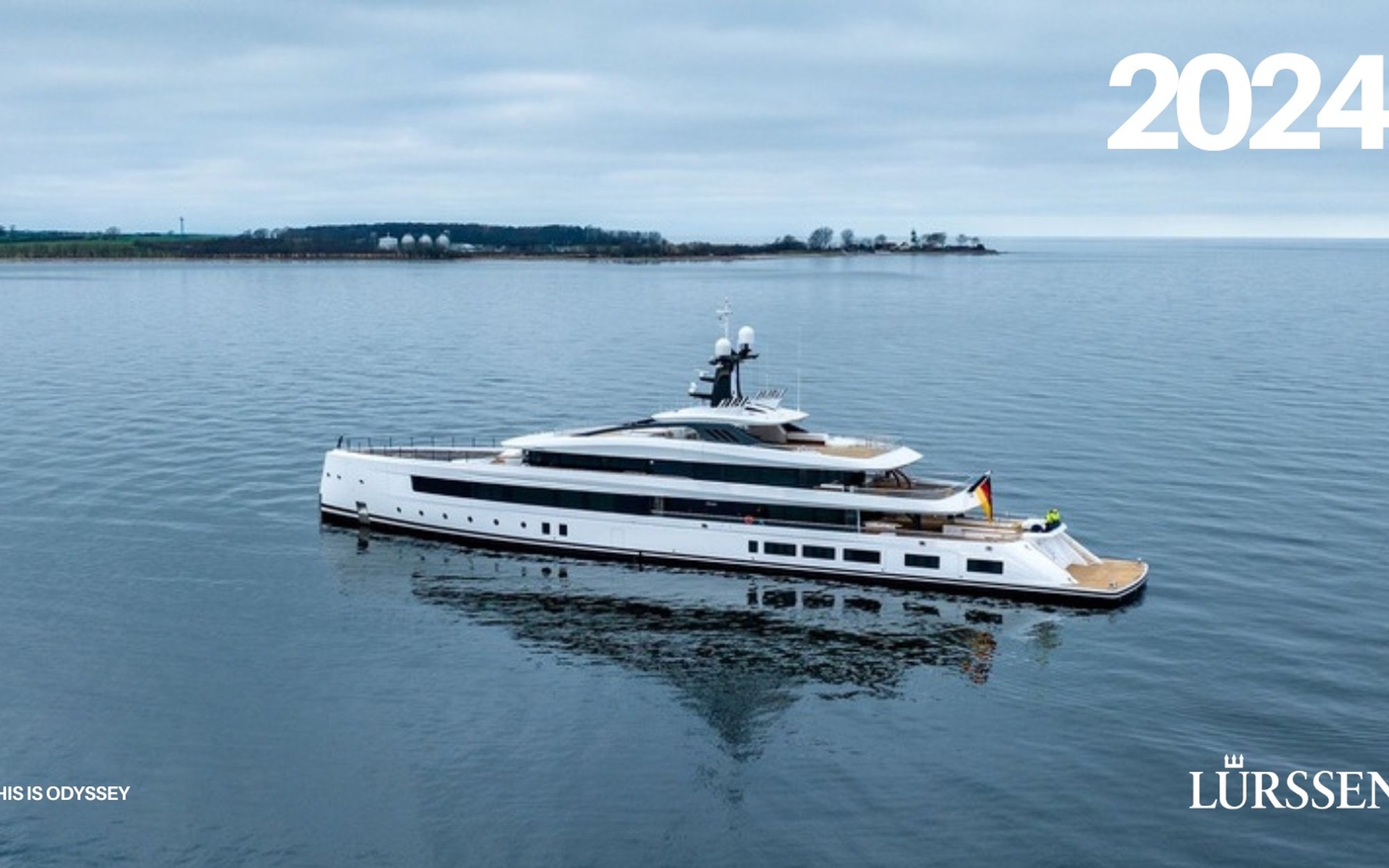 Cover of the 2024 Lürssen annual report by This is Odyssey, a yacht at anchor under a grey sky