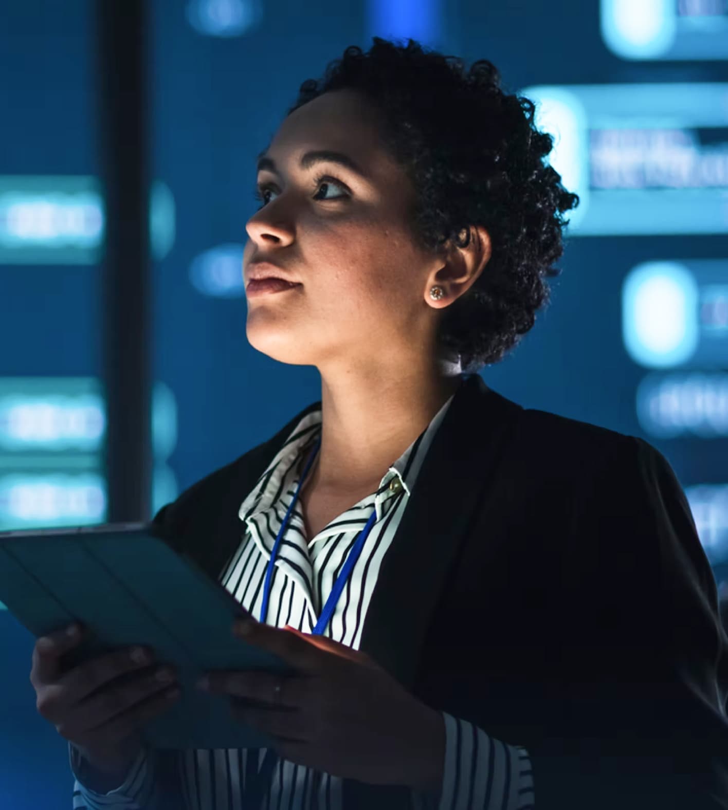 Woman holding a tablet in her hand.