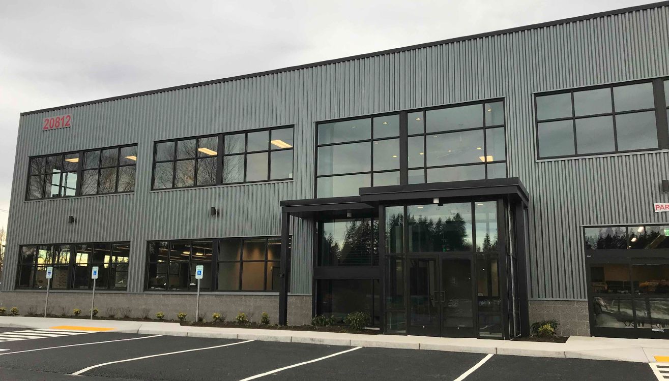 The completed two-story office frontage and main entrance.