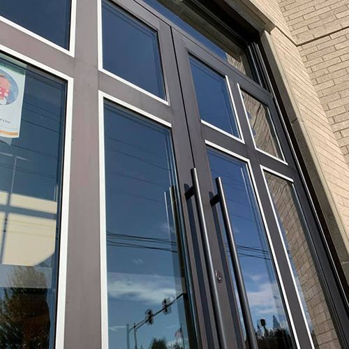 Glazed entry doors with cross-shaped detailing