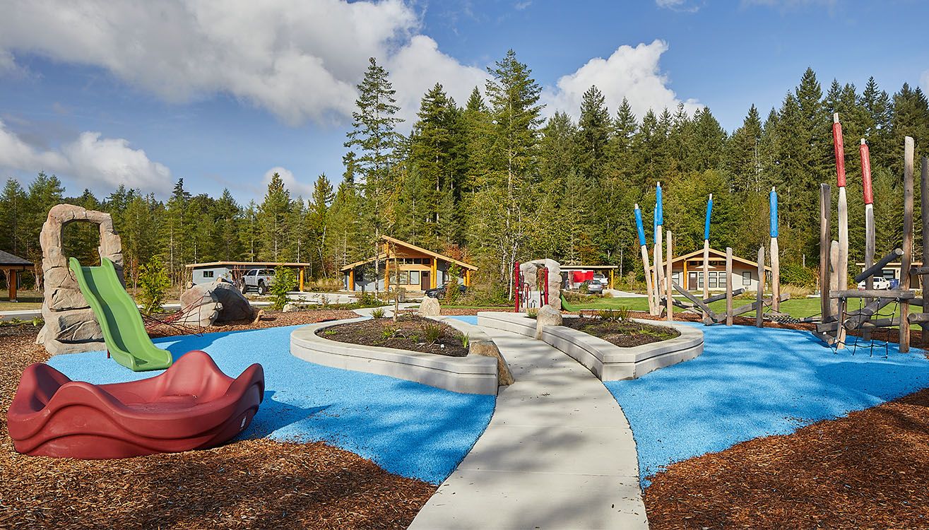 Playground and shared outdoor space beside the village homes