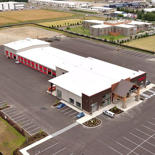 Service bays and paved circulation around the completed building