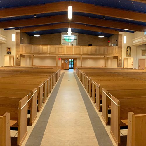 Center aisle looking toward the rear balcony and entrance