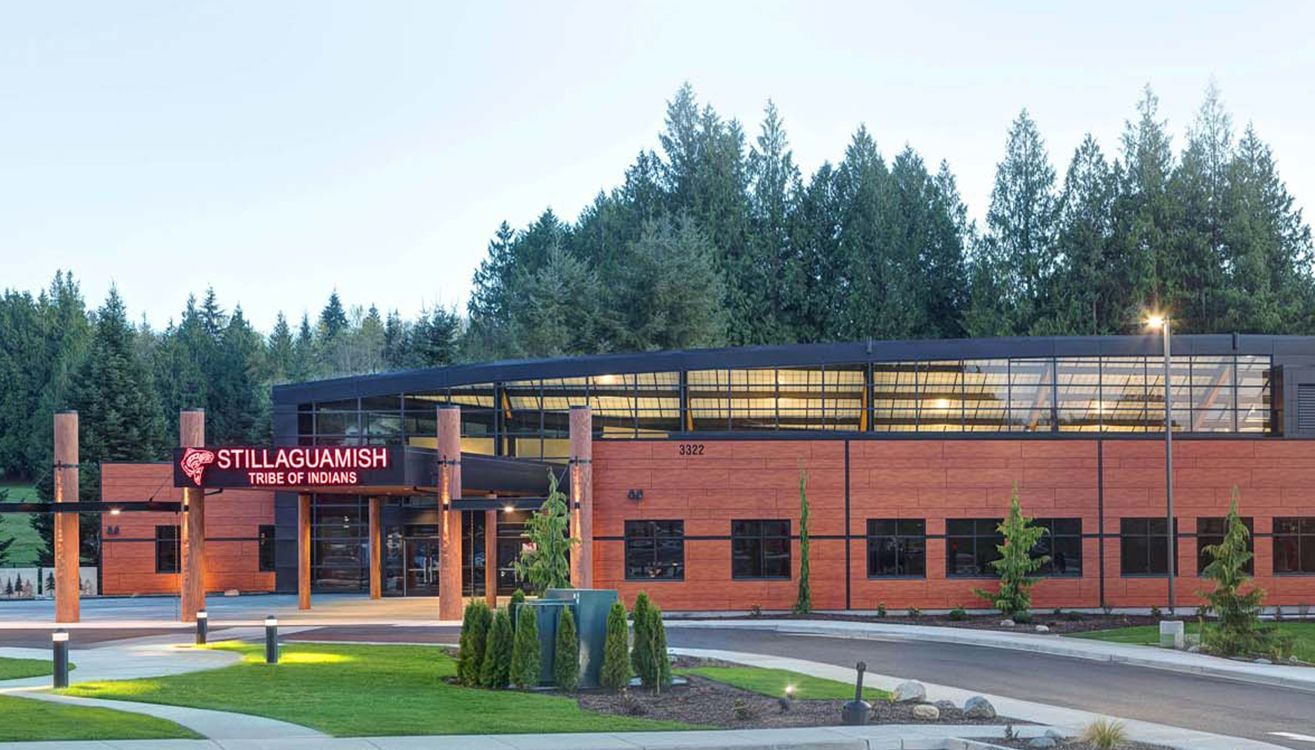 Main entrance and glazed atrium above the Stillaguamish Tribe of Indians sign