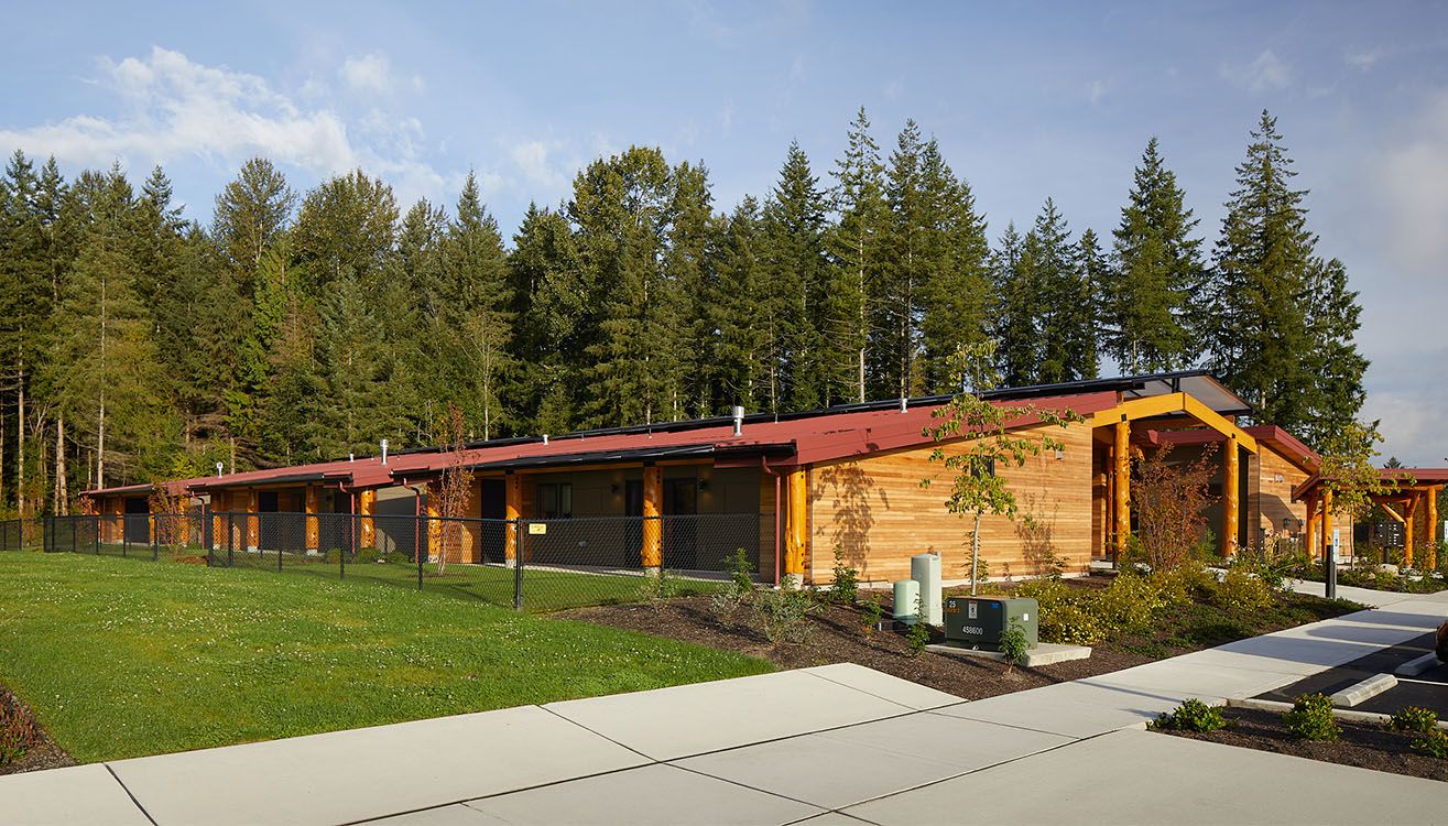 Longhouse housing and landscaped grounds