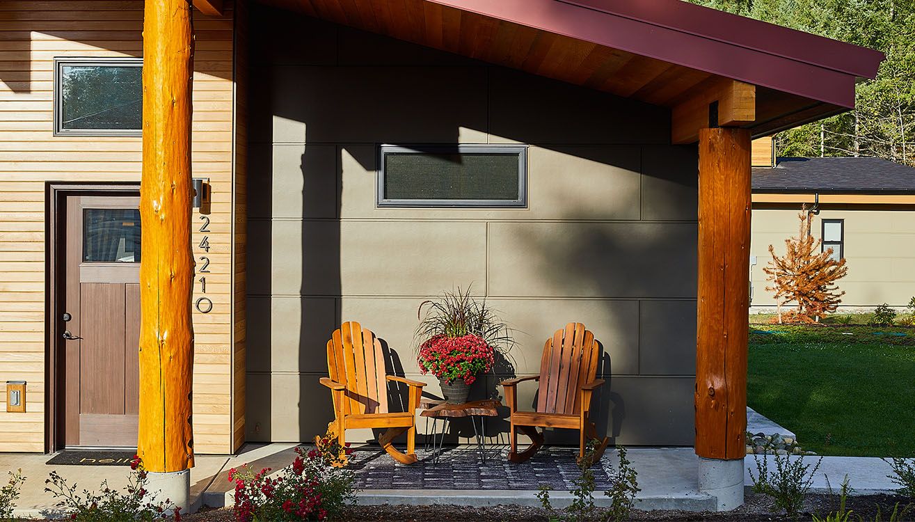 Covered cottage porch with timber columns