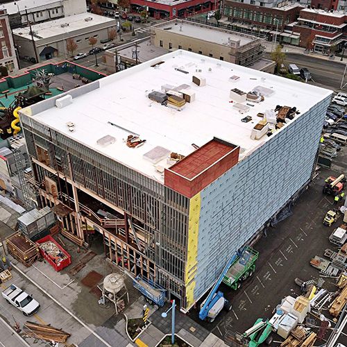 Roof and wall enclosure work beside the existing rooftop play area