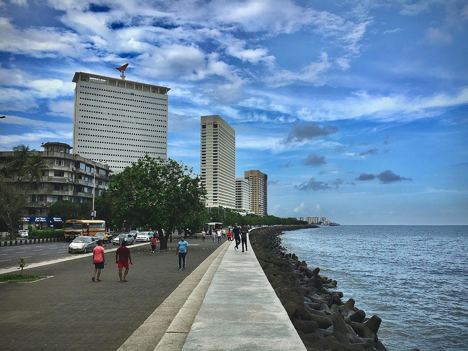 A seaside promenade and city skyline