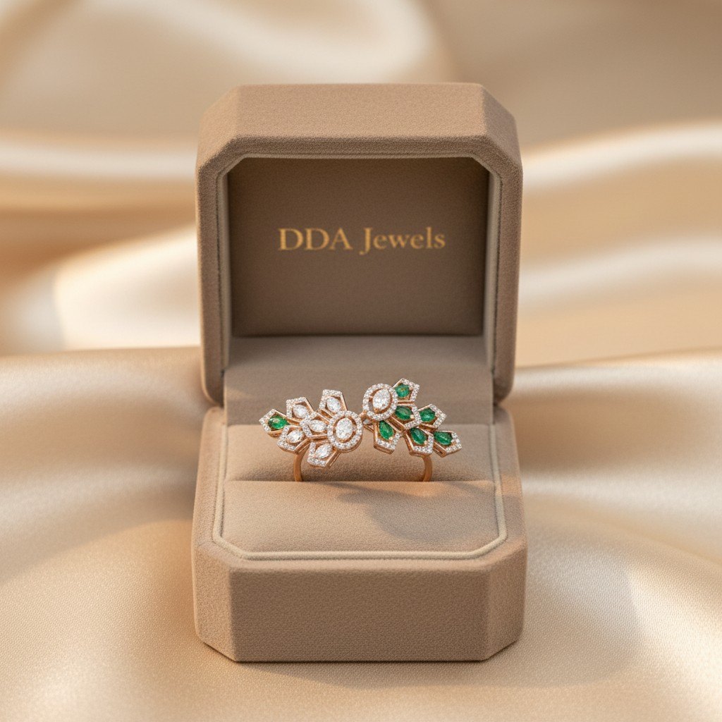Open floral diamond ring with emerald leaf cluster