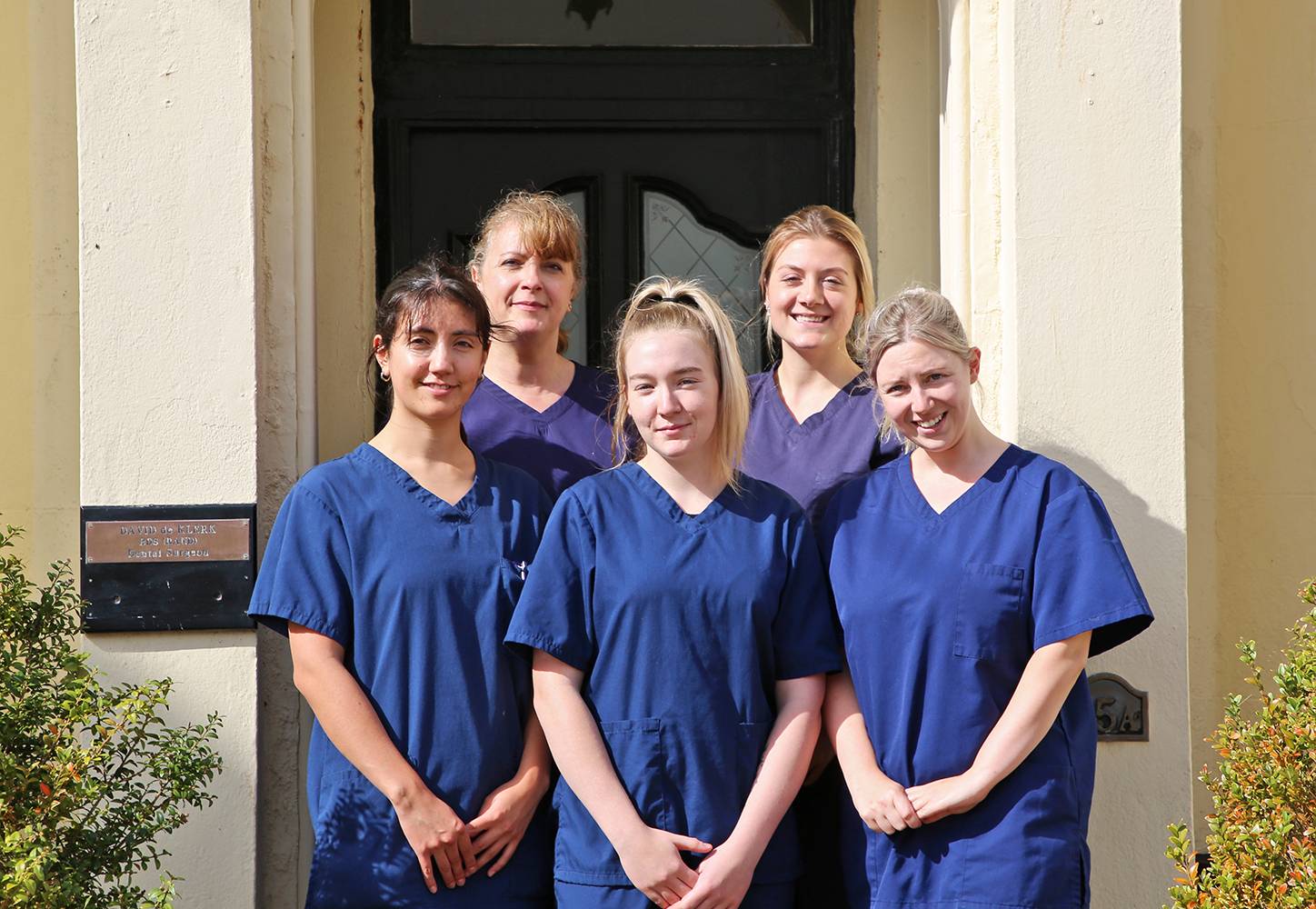 Our dental nursing team standing outside the Merrifield practice